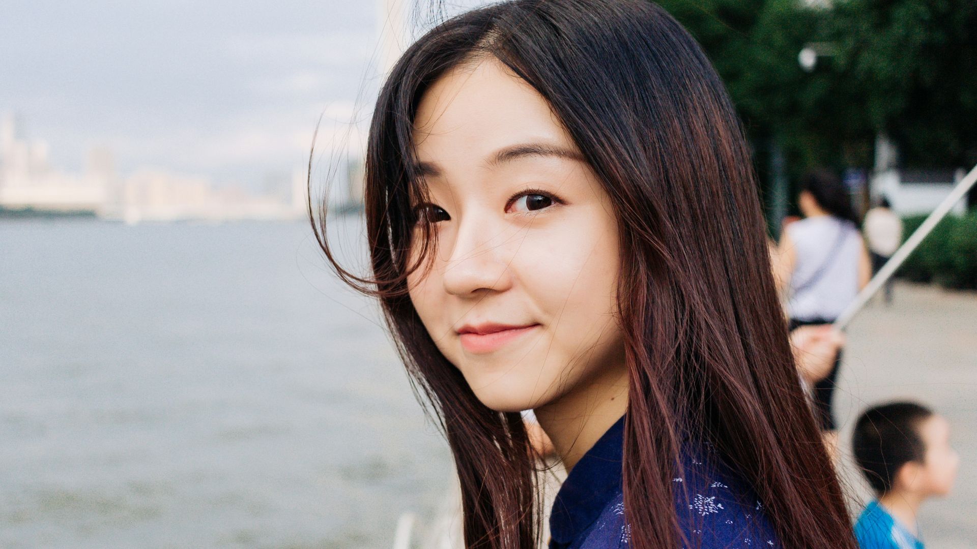 woman standing near body of water