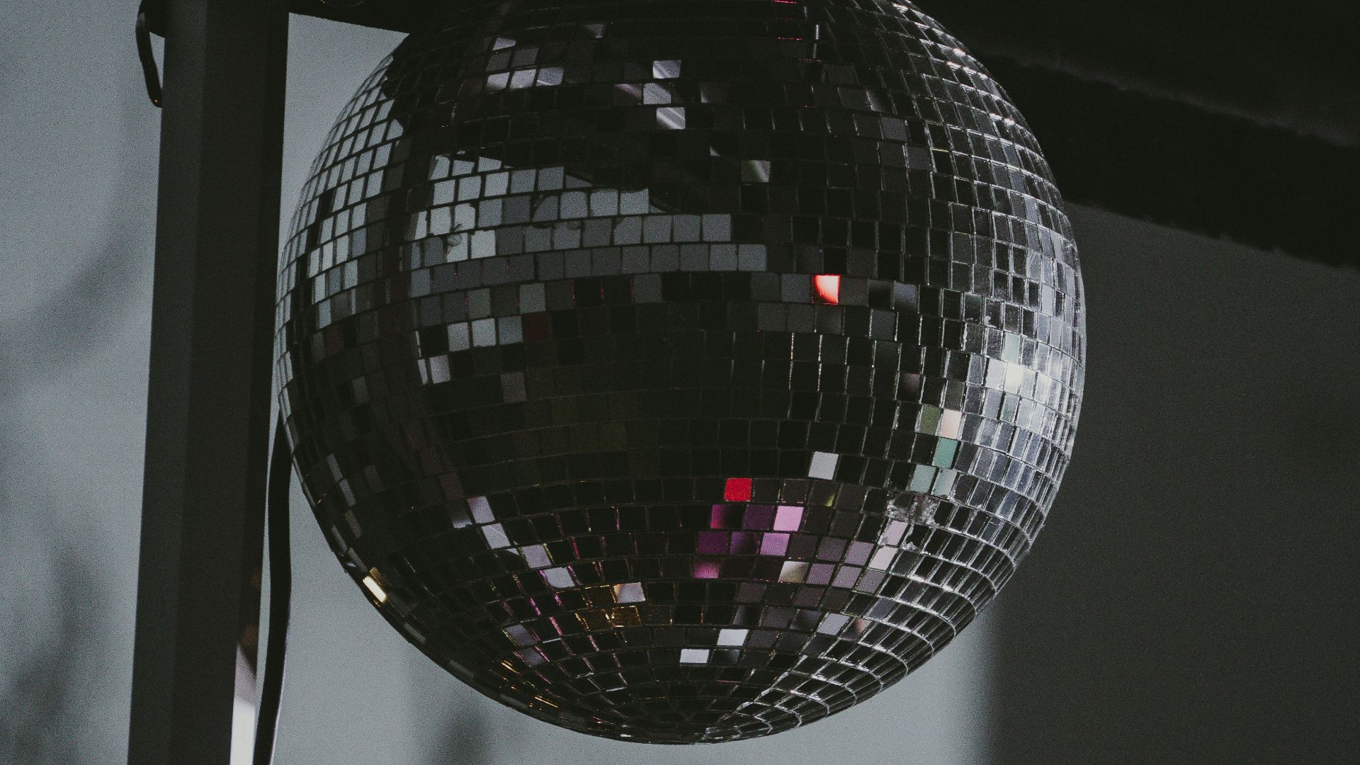 a disco ball hanging from the side of a building
