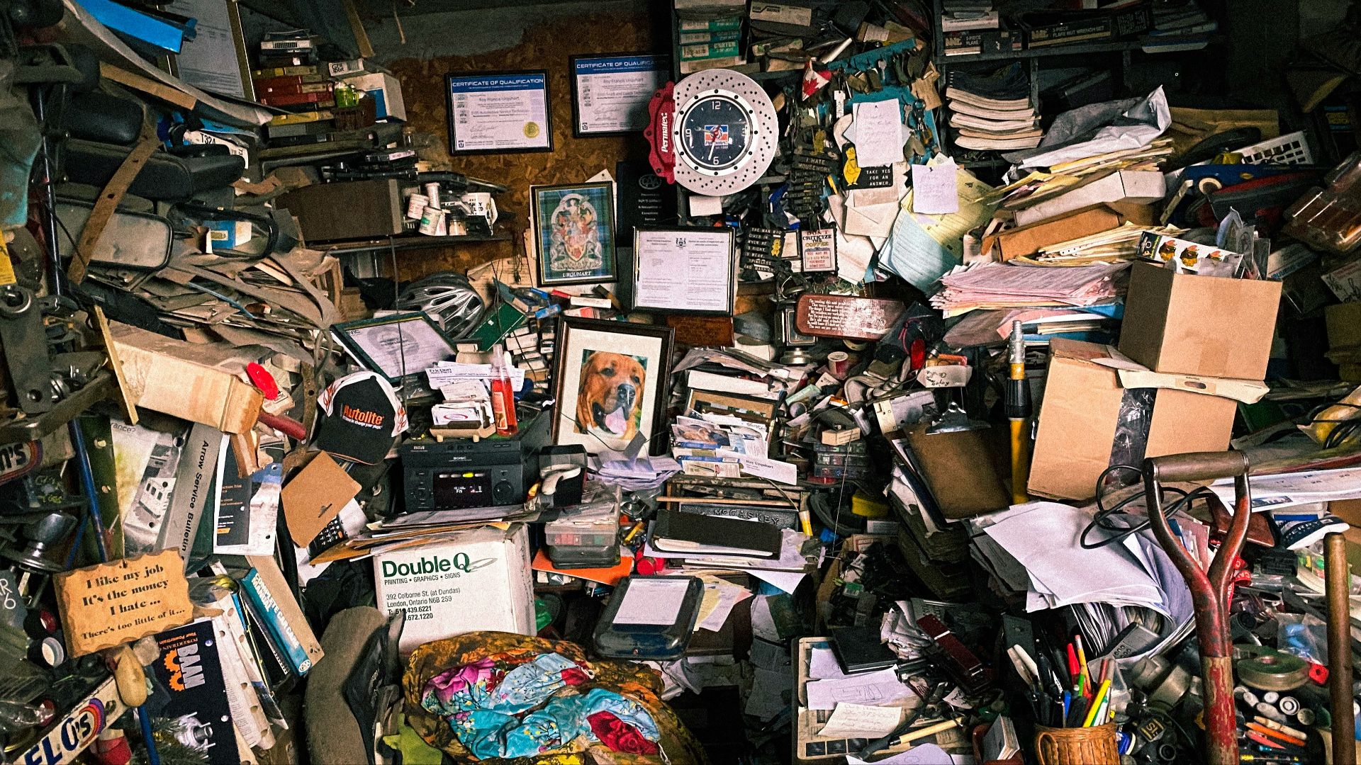 assorted books on brown wooden shelf