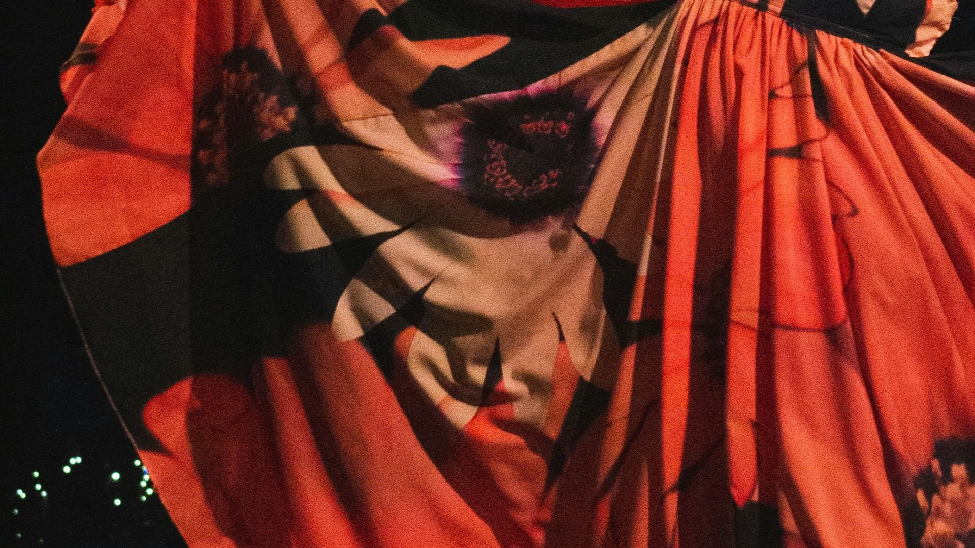 woman in red dress dancing