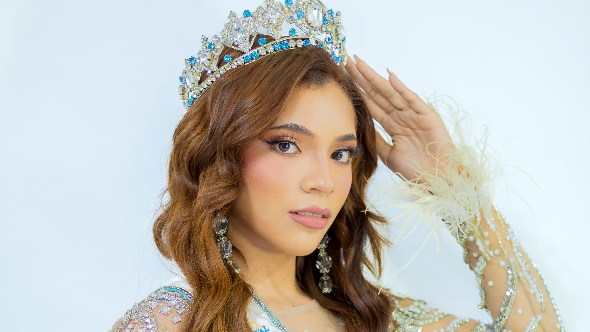 A beautiful young lady wearing a tiara