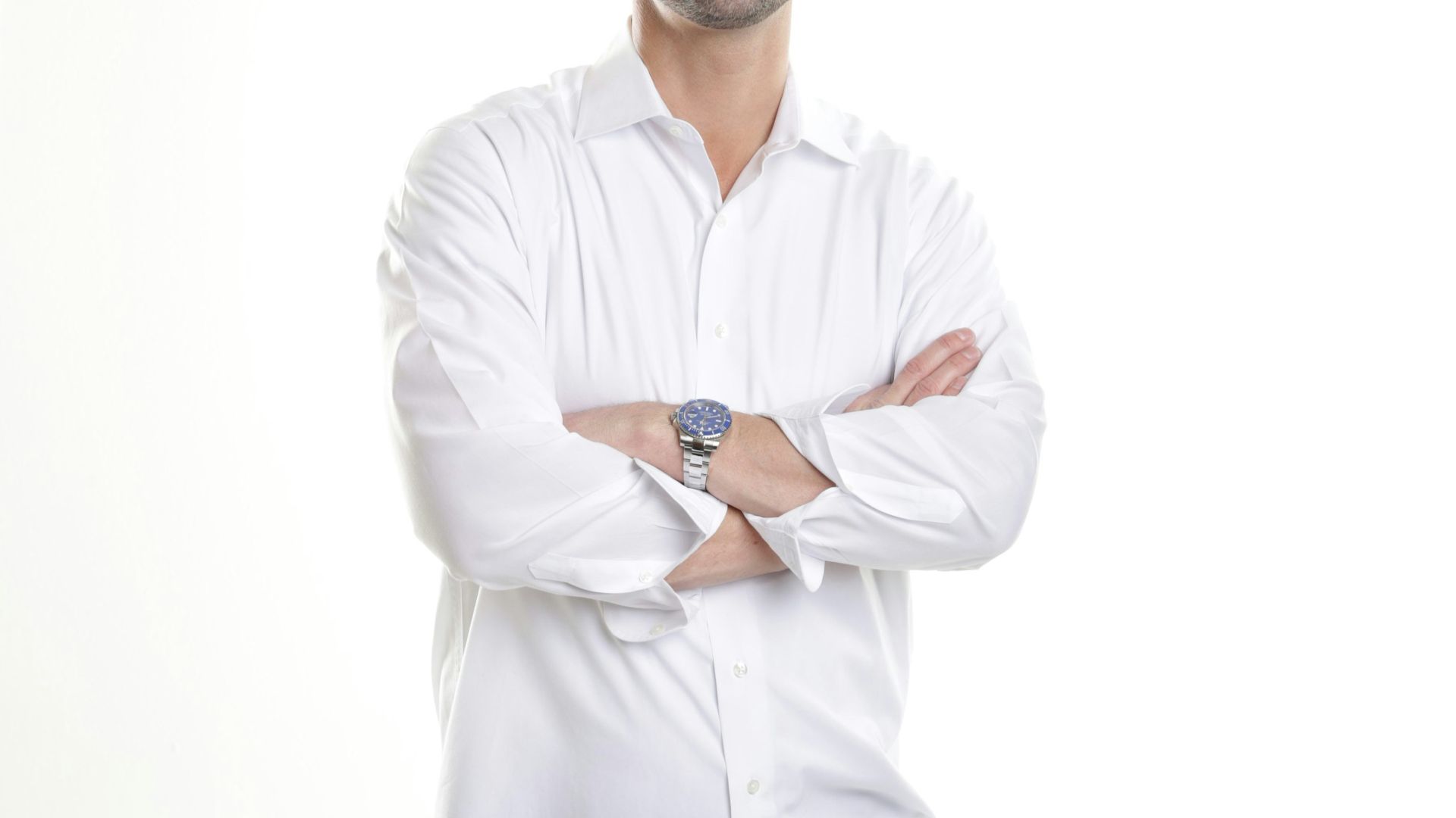 man in white dress shirt and blue denim jeans