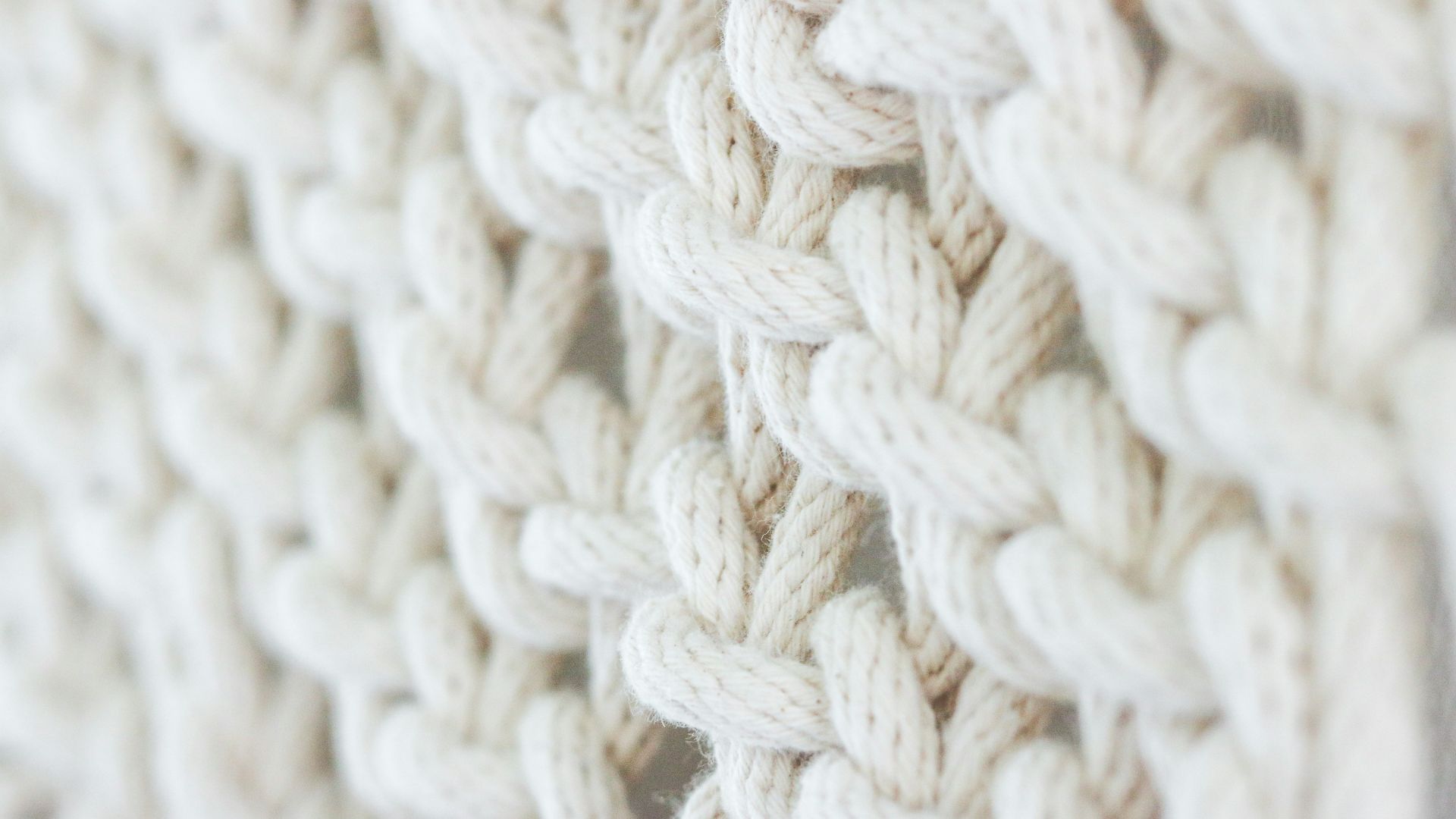 white knit textile on brown wooden table