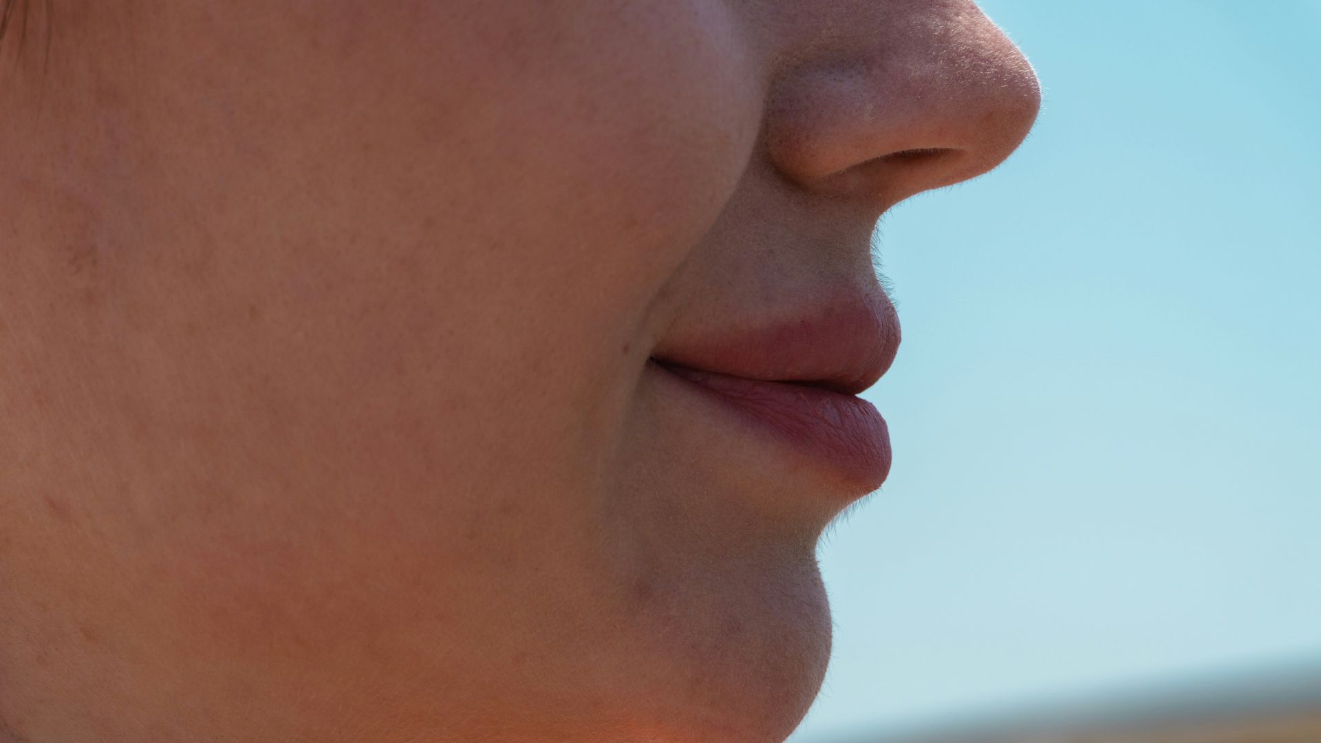 Close-up of a person's chin and mouth