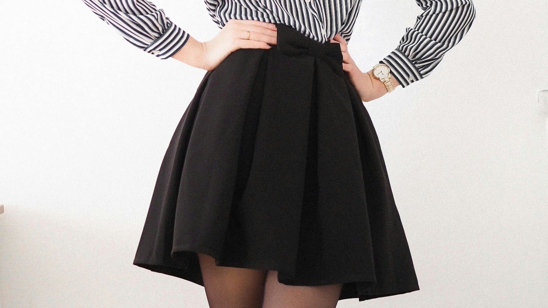 woman in black and white striped long sleeve dress