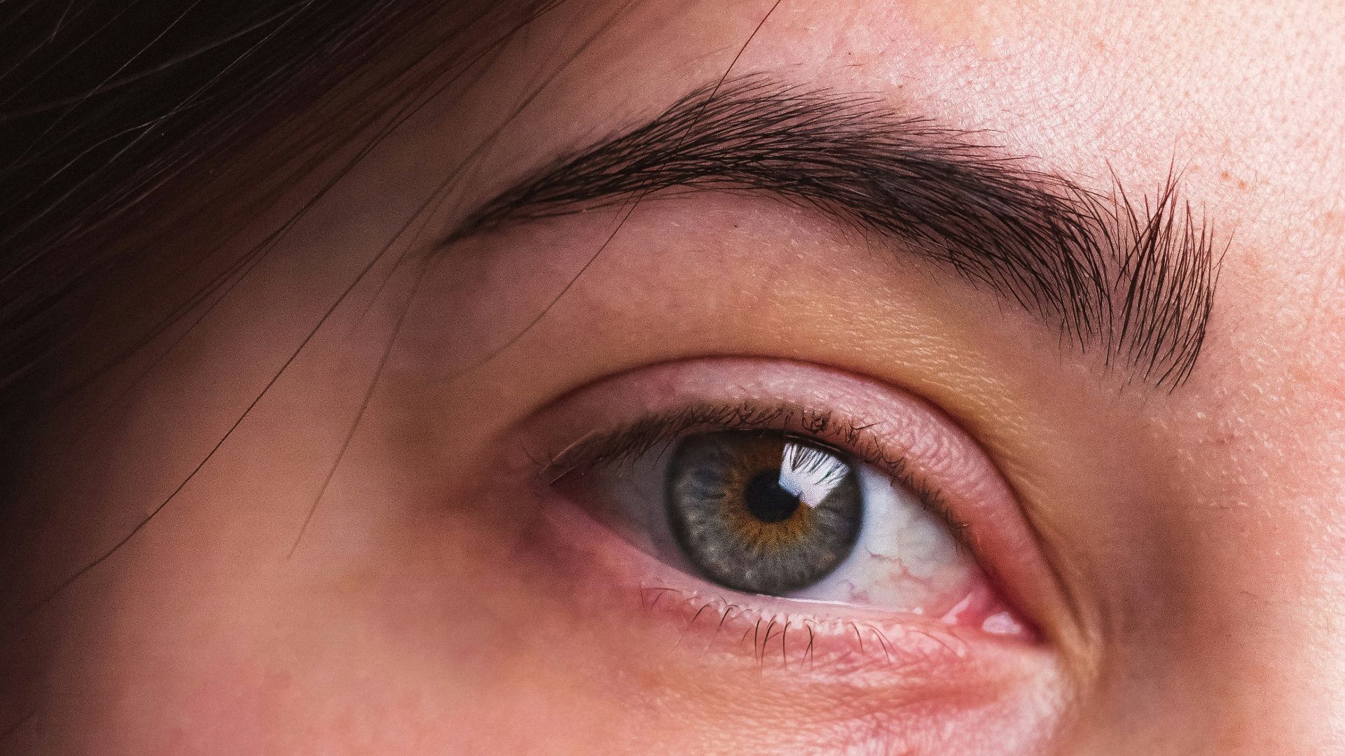 a close up of a person with a tooth brush in their mouth
