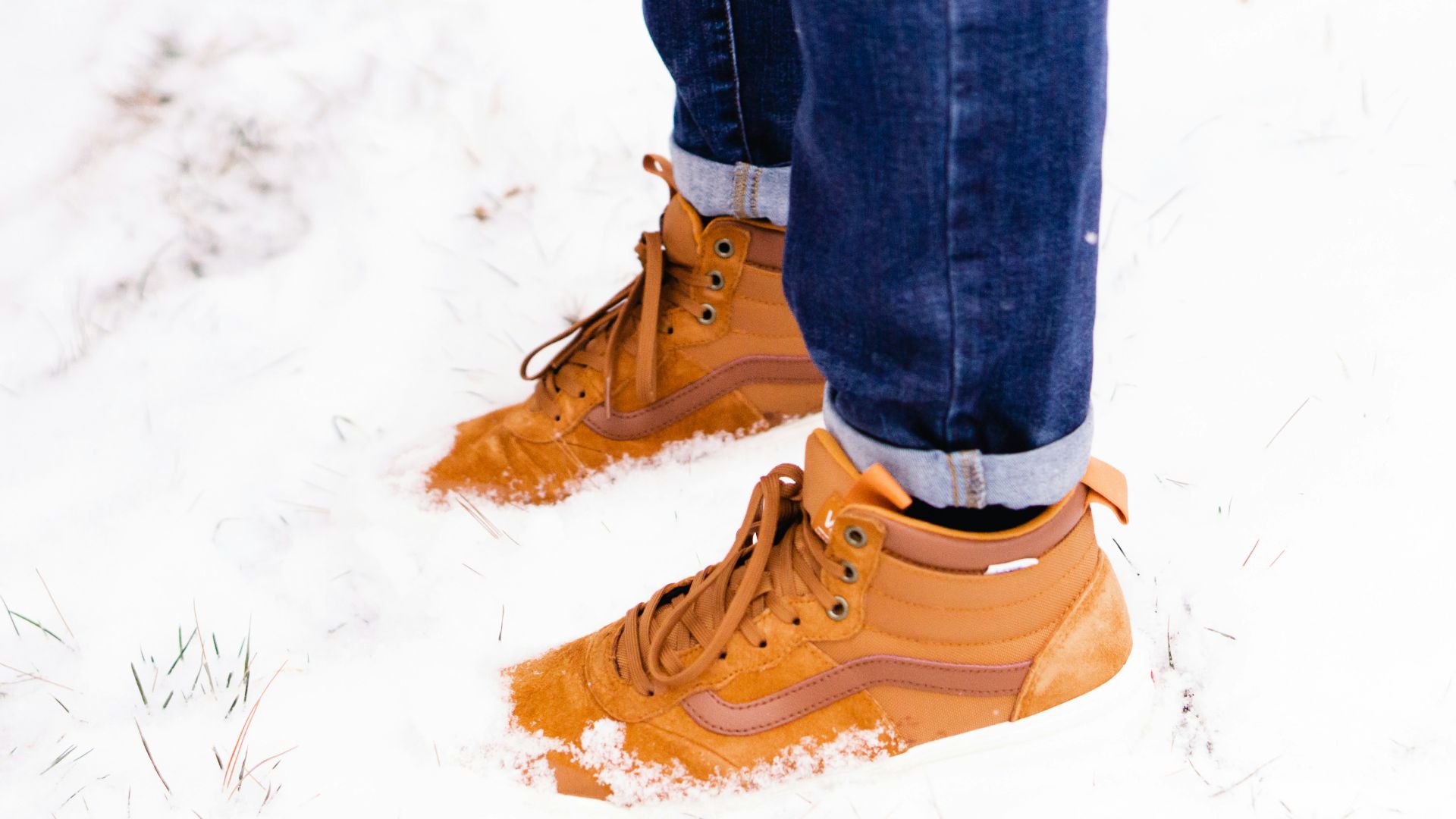 man steeping on snow