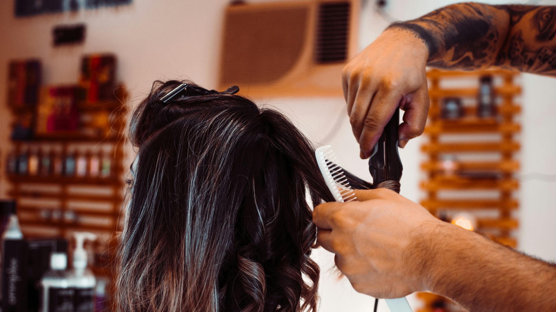 woman in white shirt holding hair blower