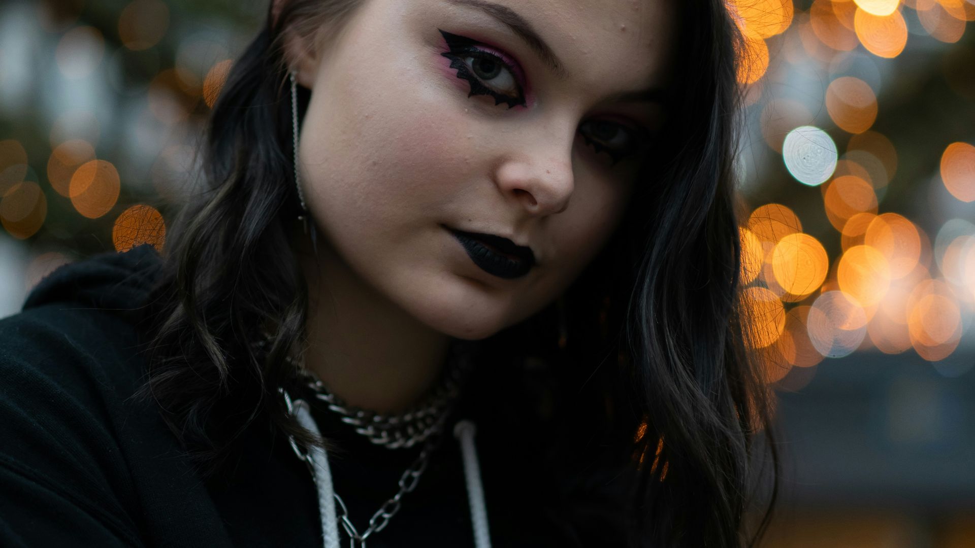 woman in black and pink floral long sleeve shirt