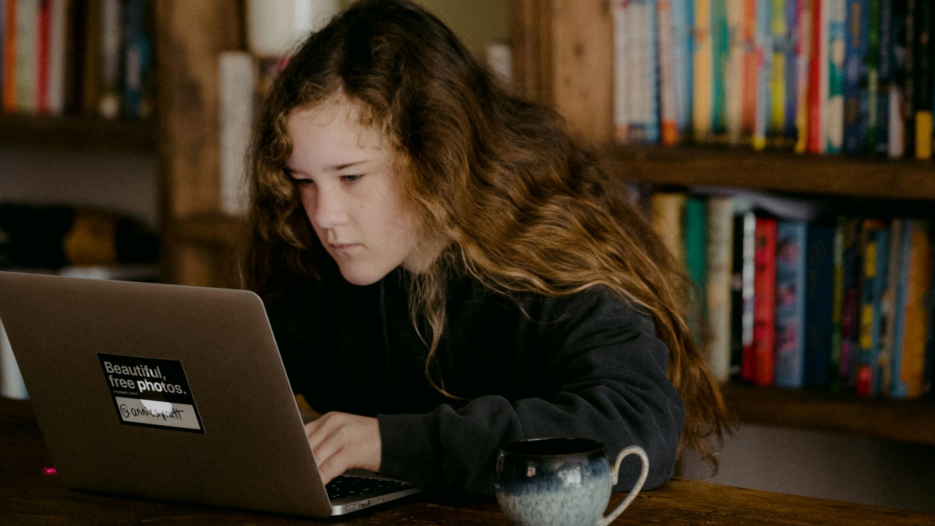 woman in black shirt sitting on chair