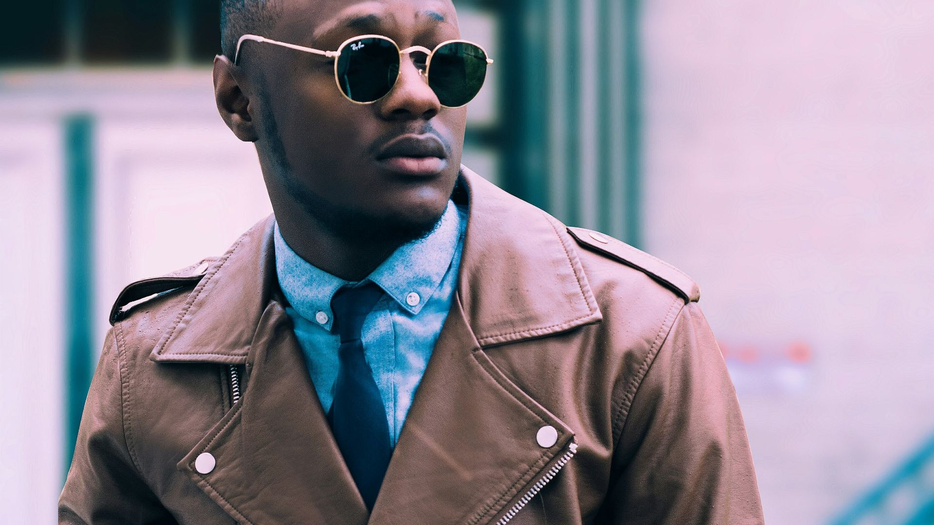 man in brown leather coat