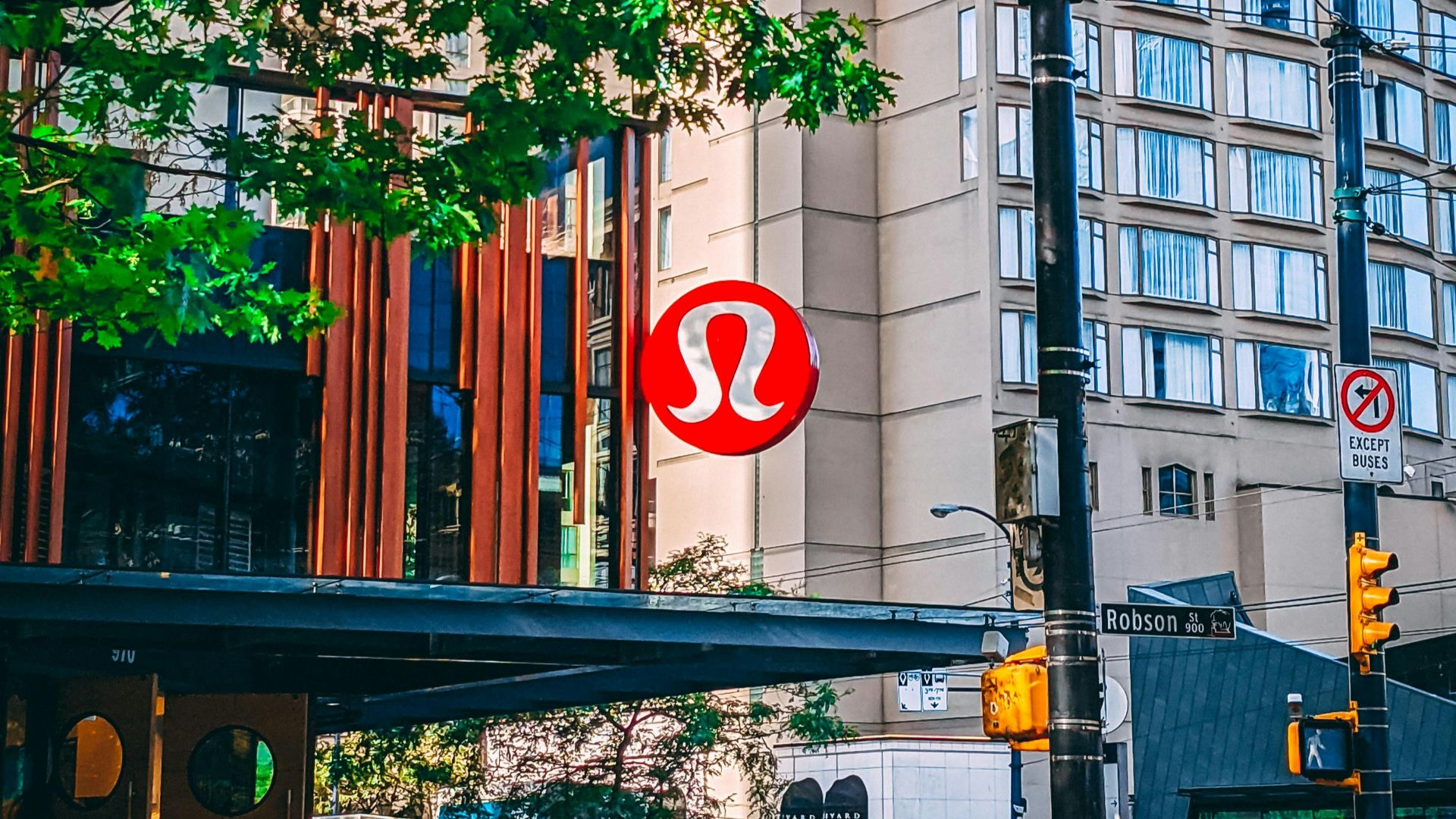 a red sign that is on the side of a building