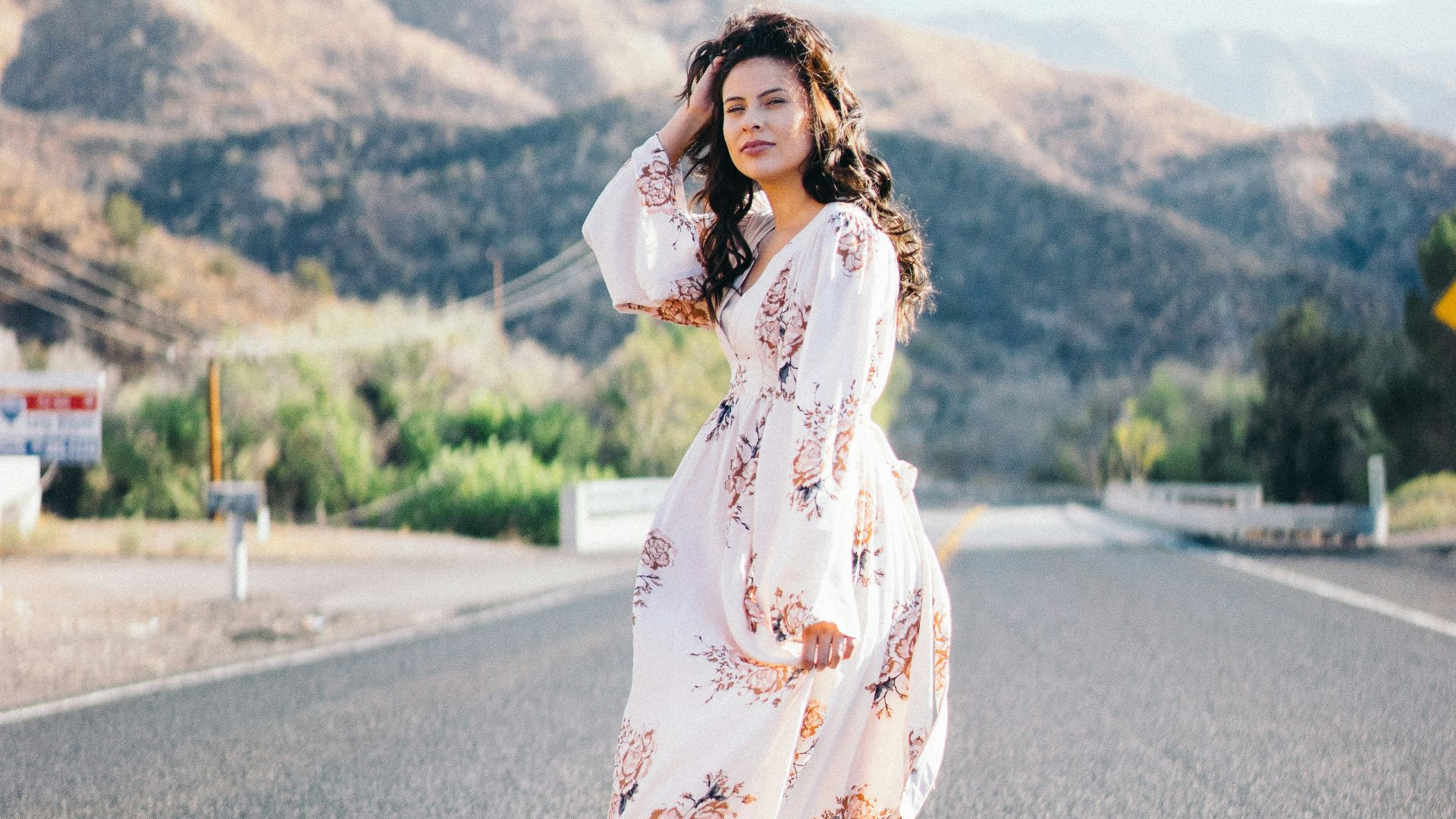woman standing in the middle of the road