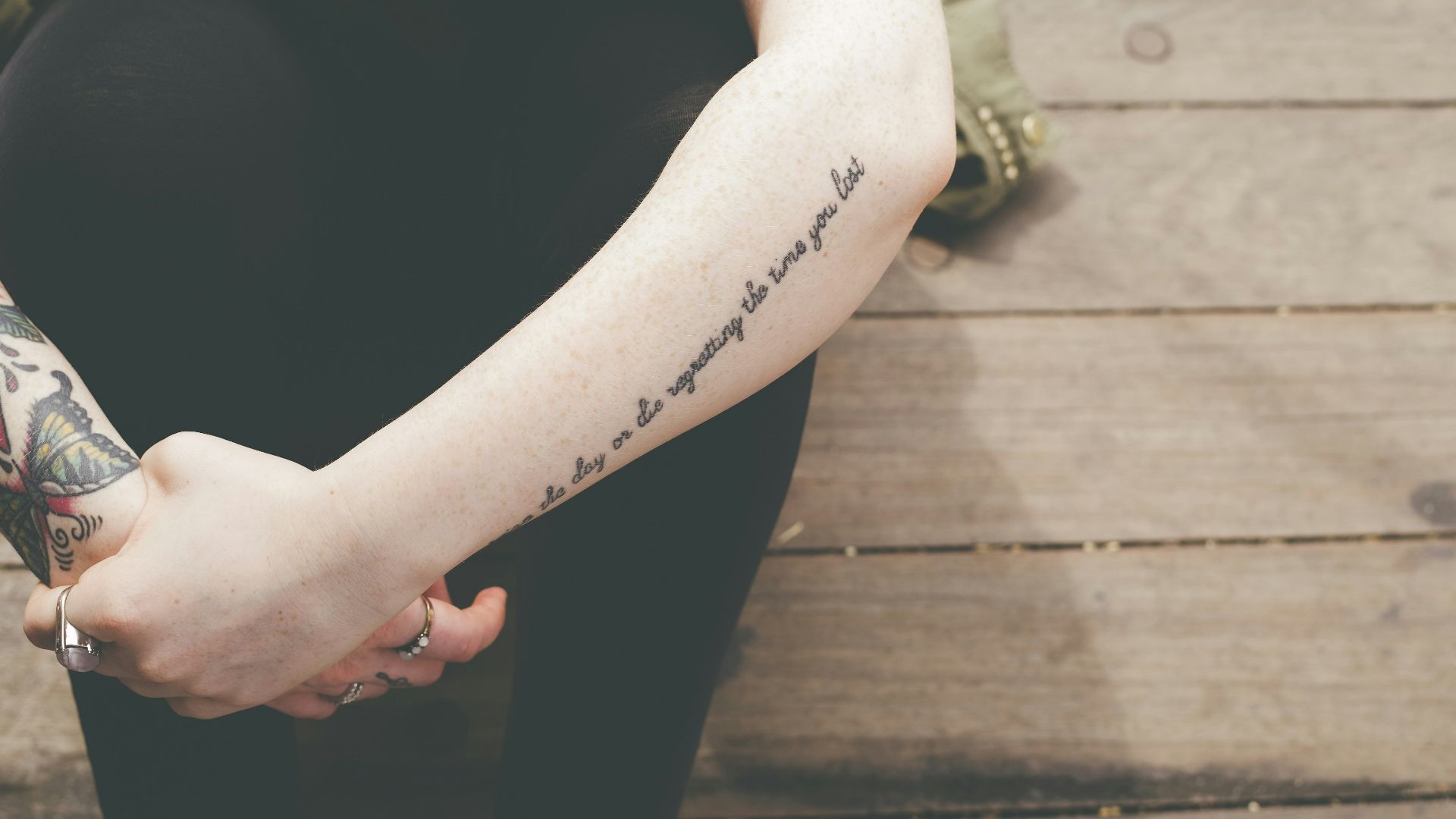 human hand with black tattoes