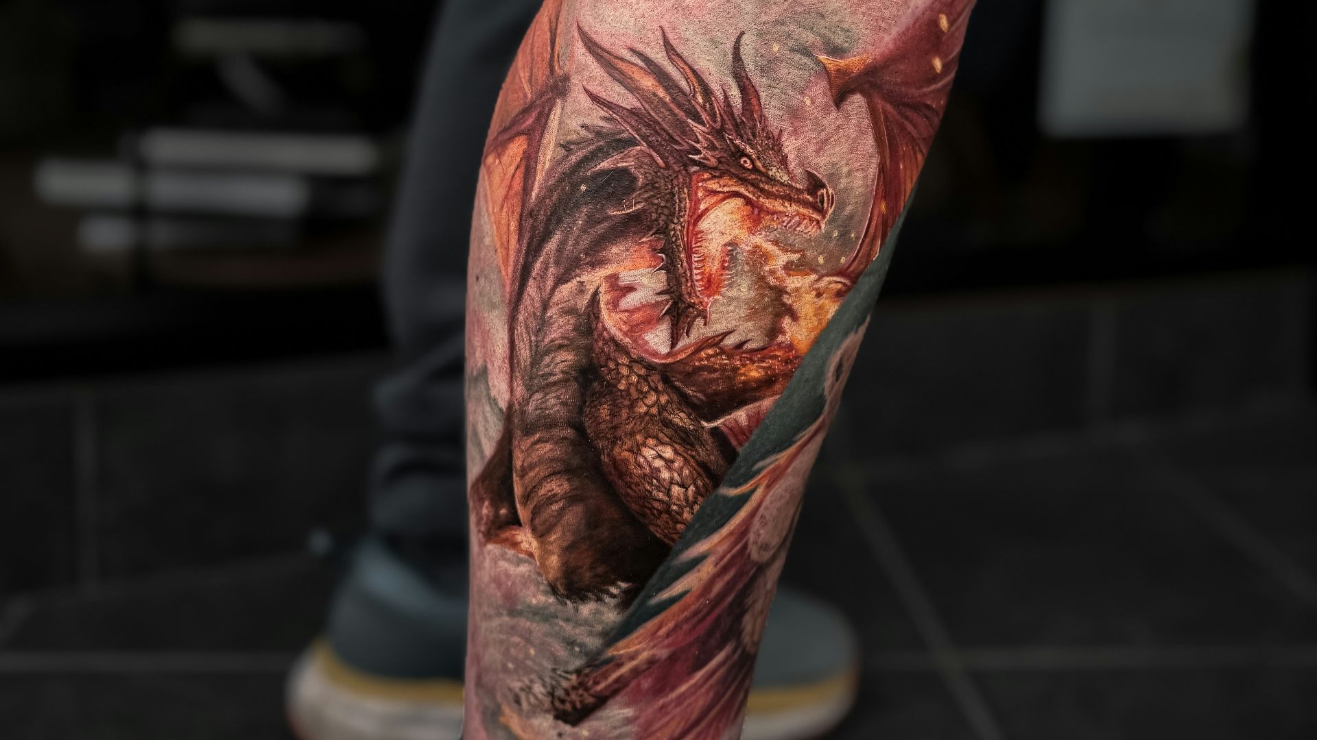 A man with a tattoo on his leg