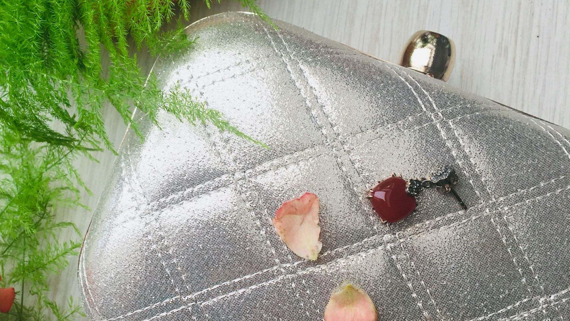 silver leather pouch with red beads