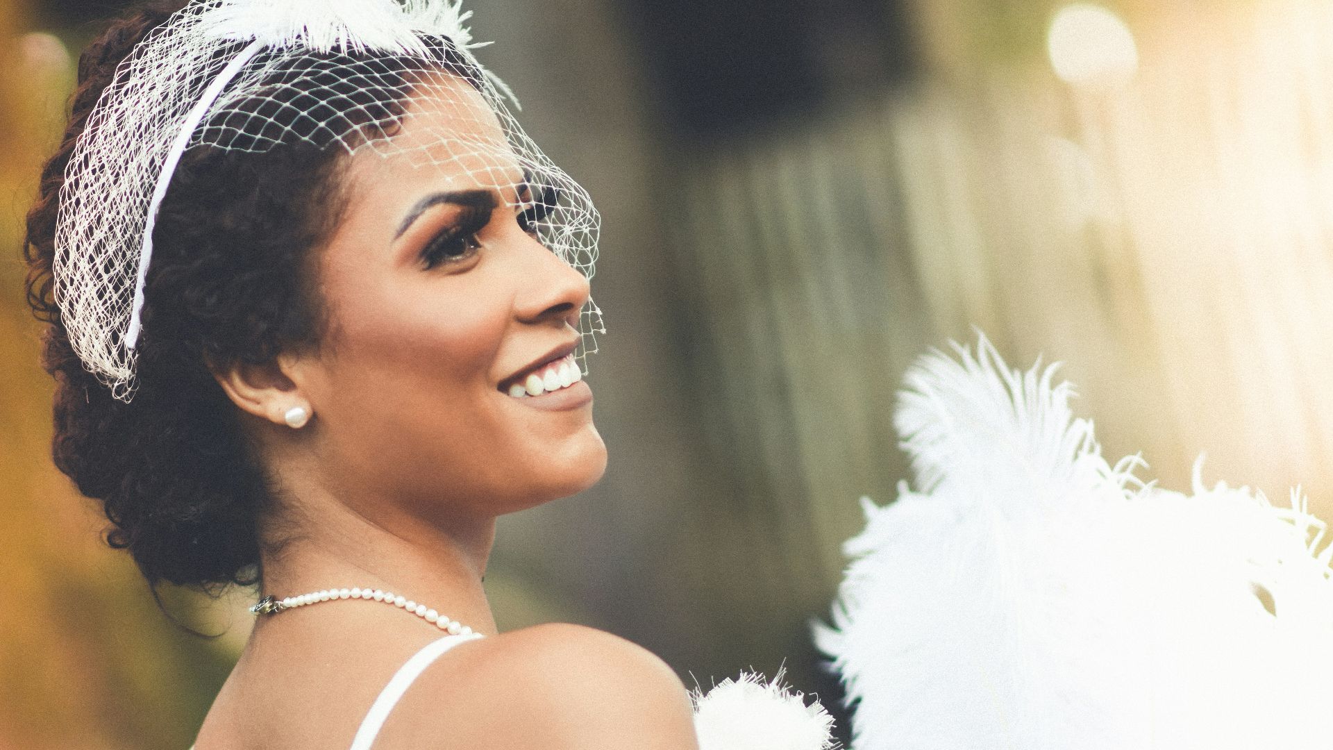 woman in white feather headdress