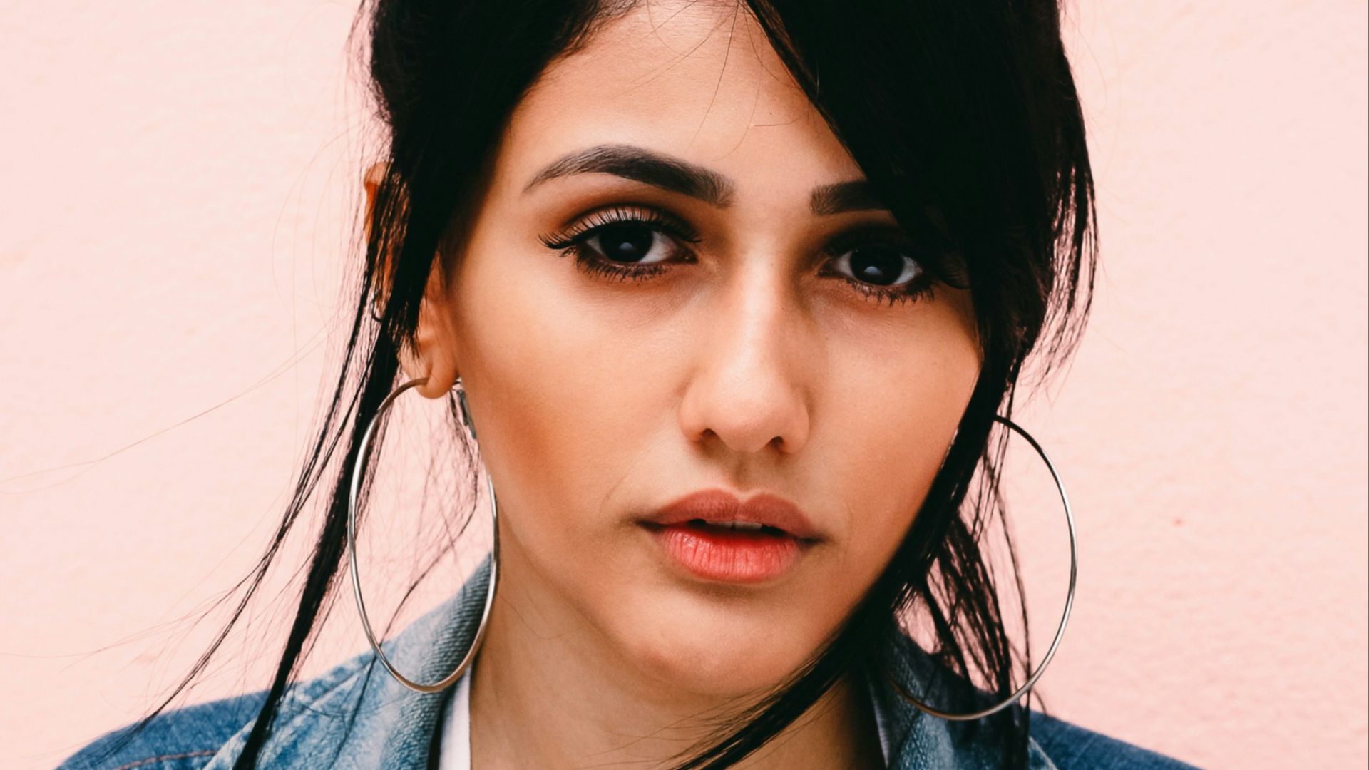 woman wearing blue denim jacket