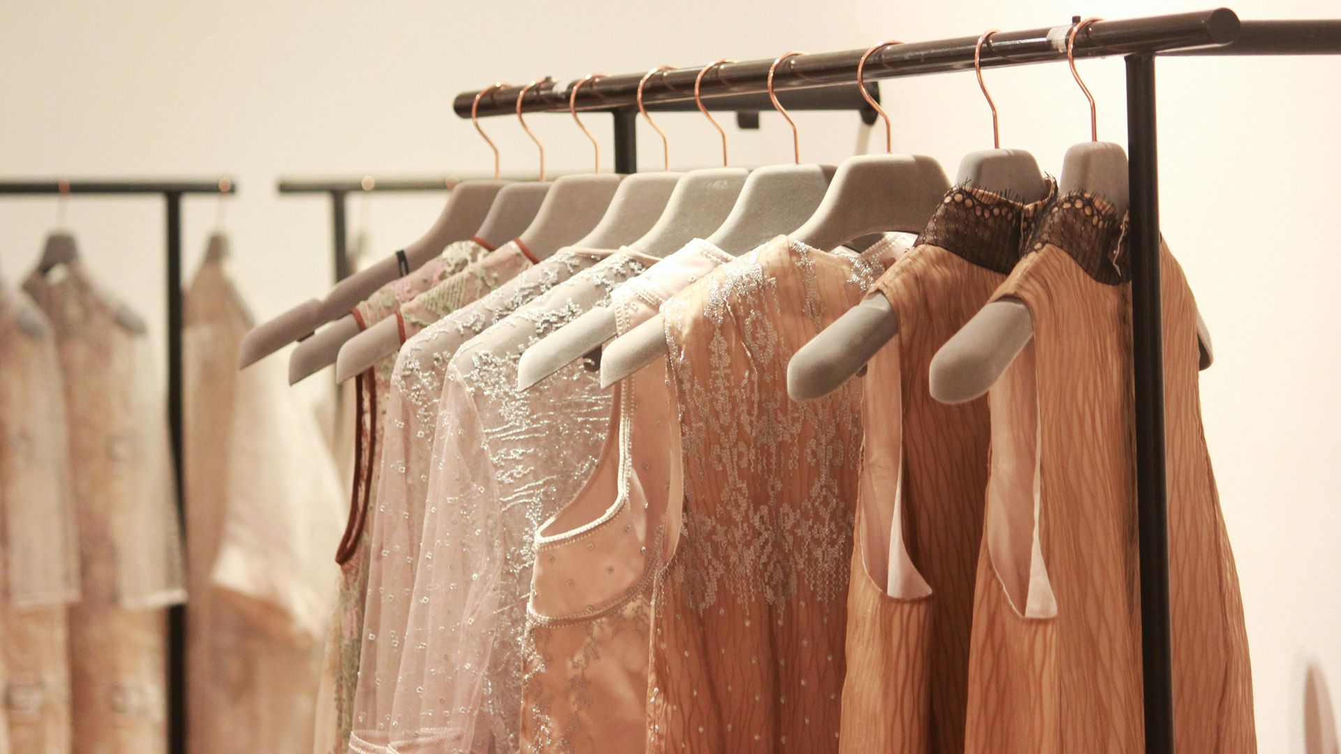 assorted tops hanging indoors