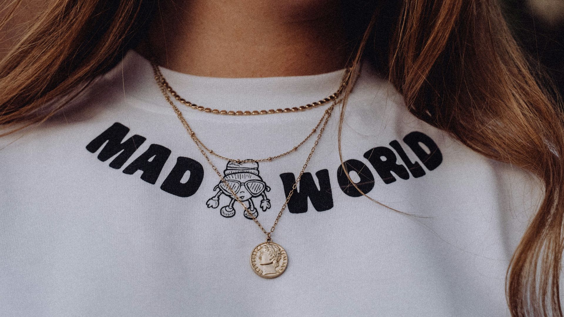 a close up of a woman wearing a blue shirt