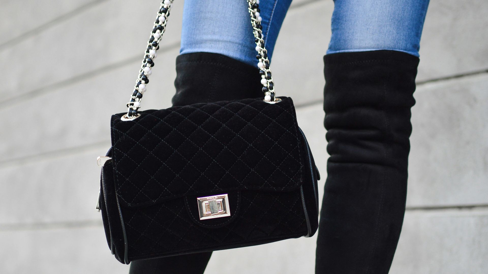 person carrying black sling bag