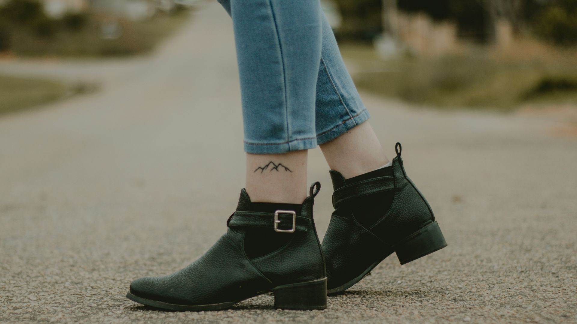 person standing on gray concrete road during daytime