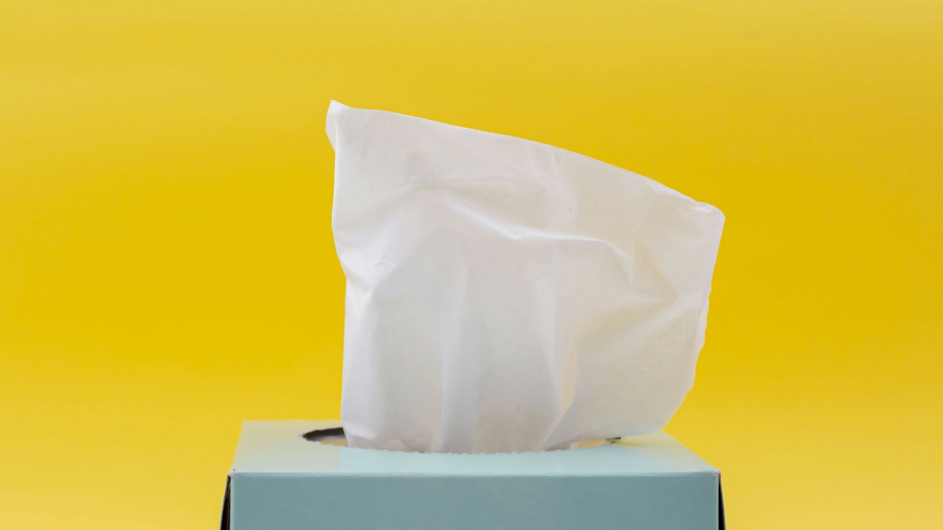 white tissue paper in blue box