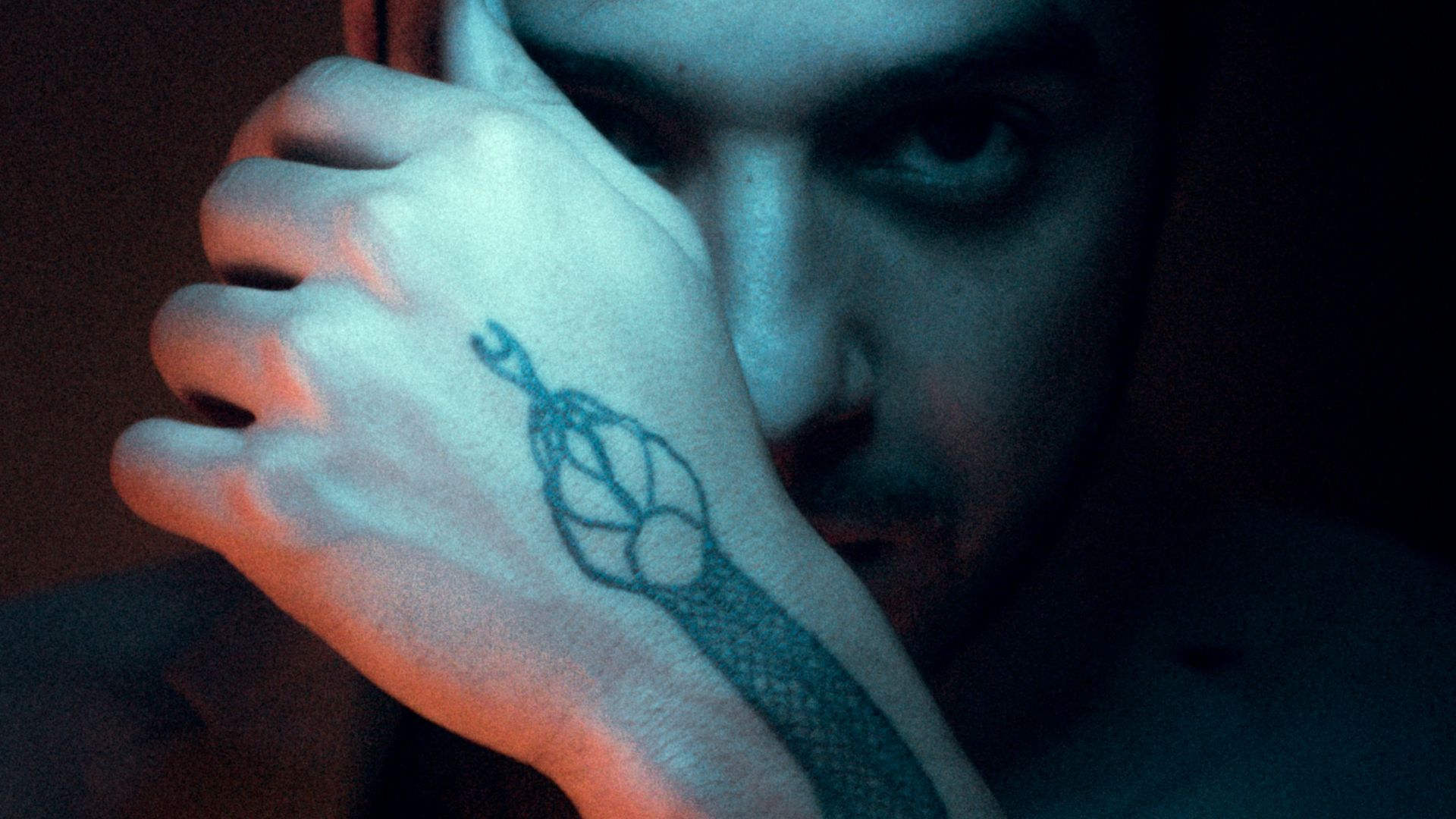 a man with a tattoo on his arm