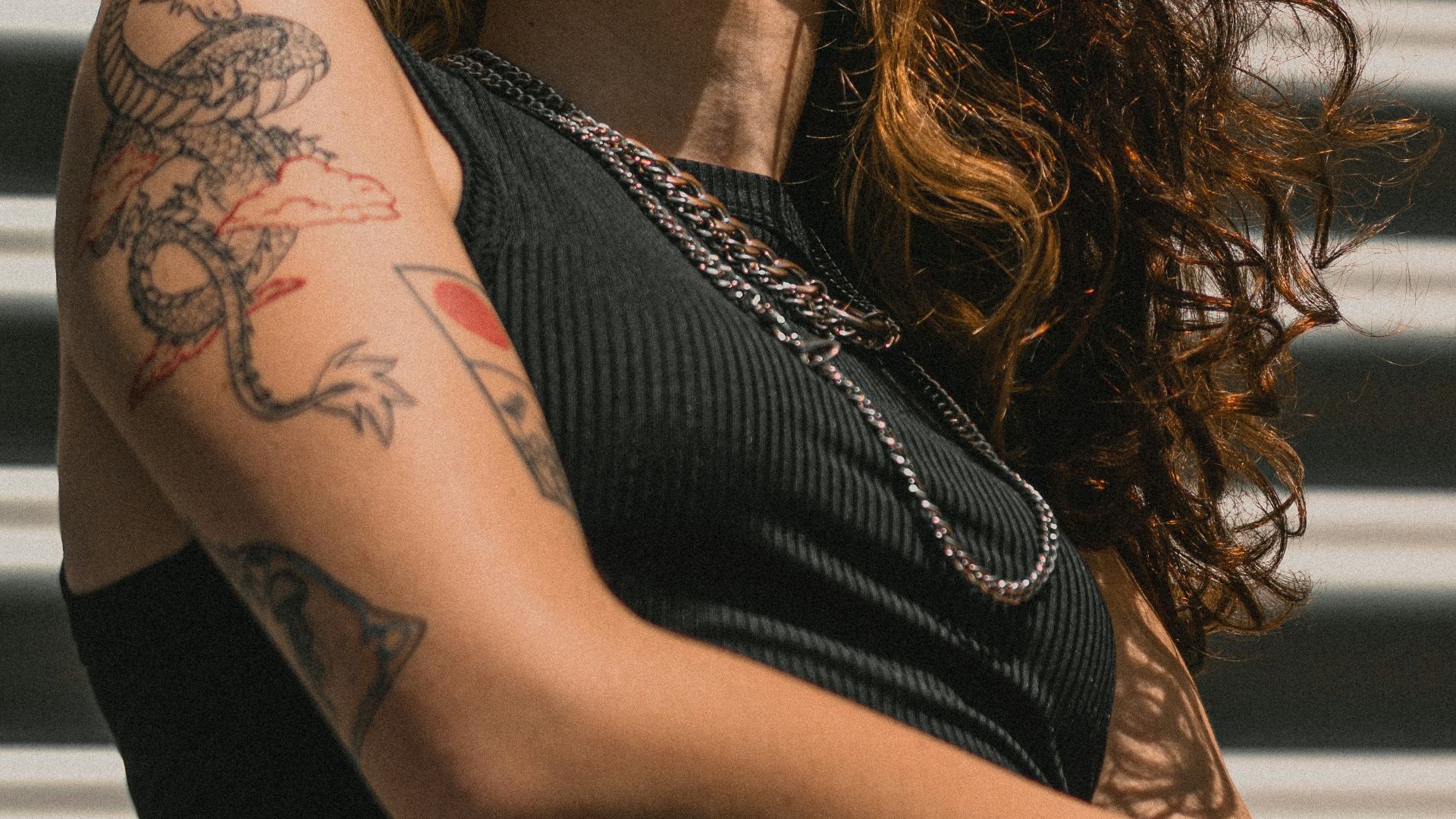 a woman with a tattoo on her arm