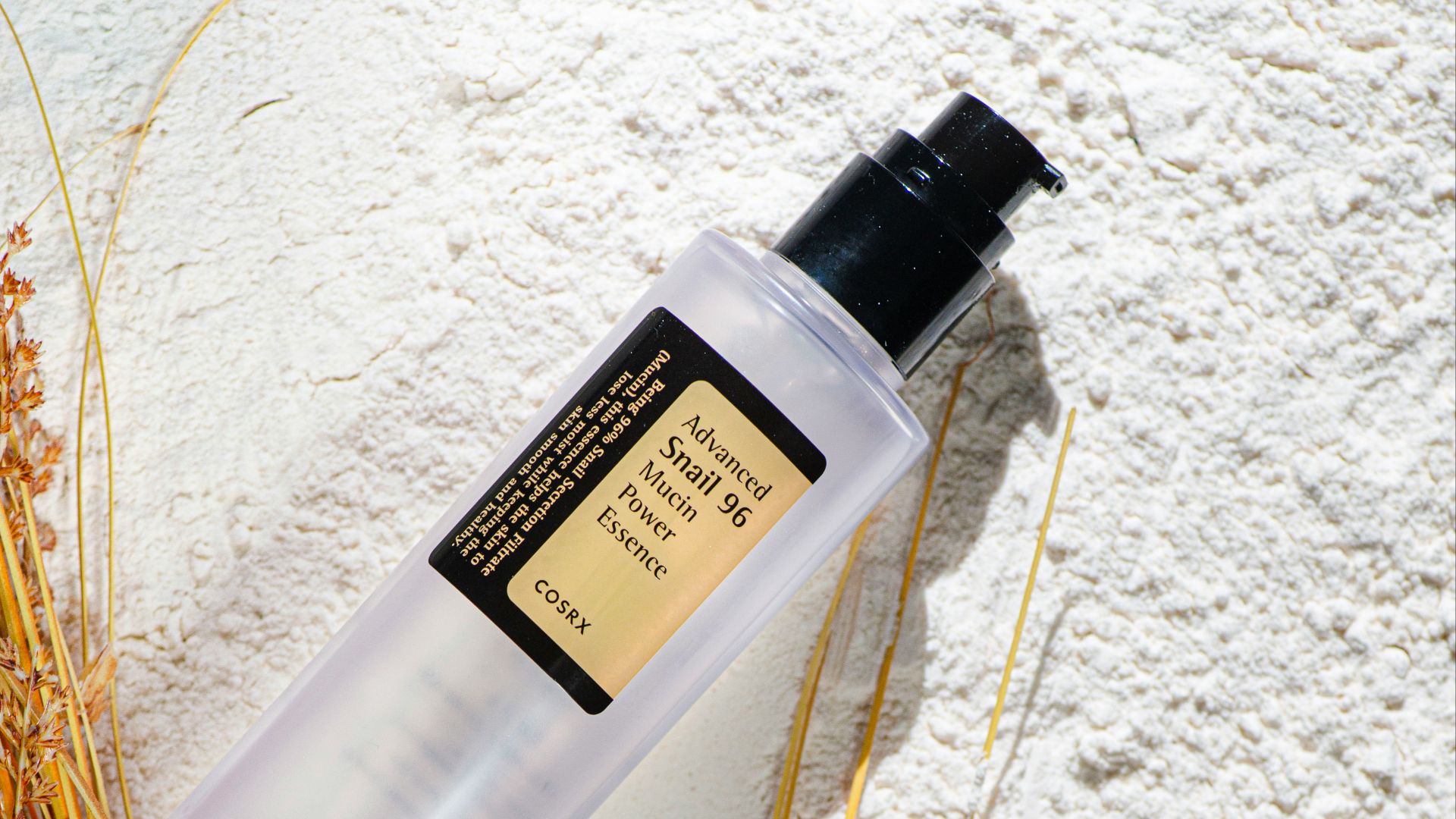 A couple of bottles of lotion sitting on top of a table