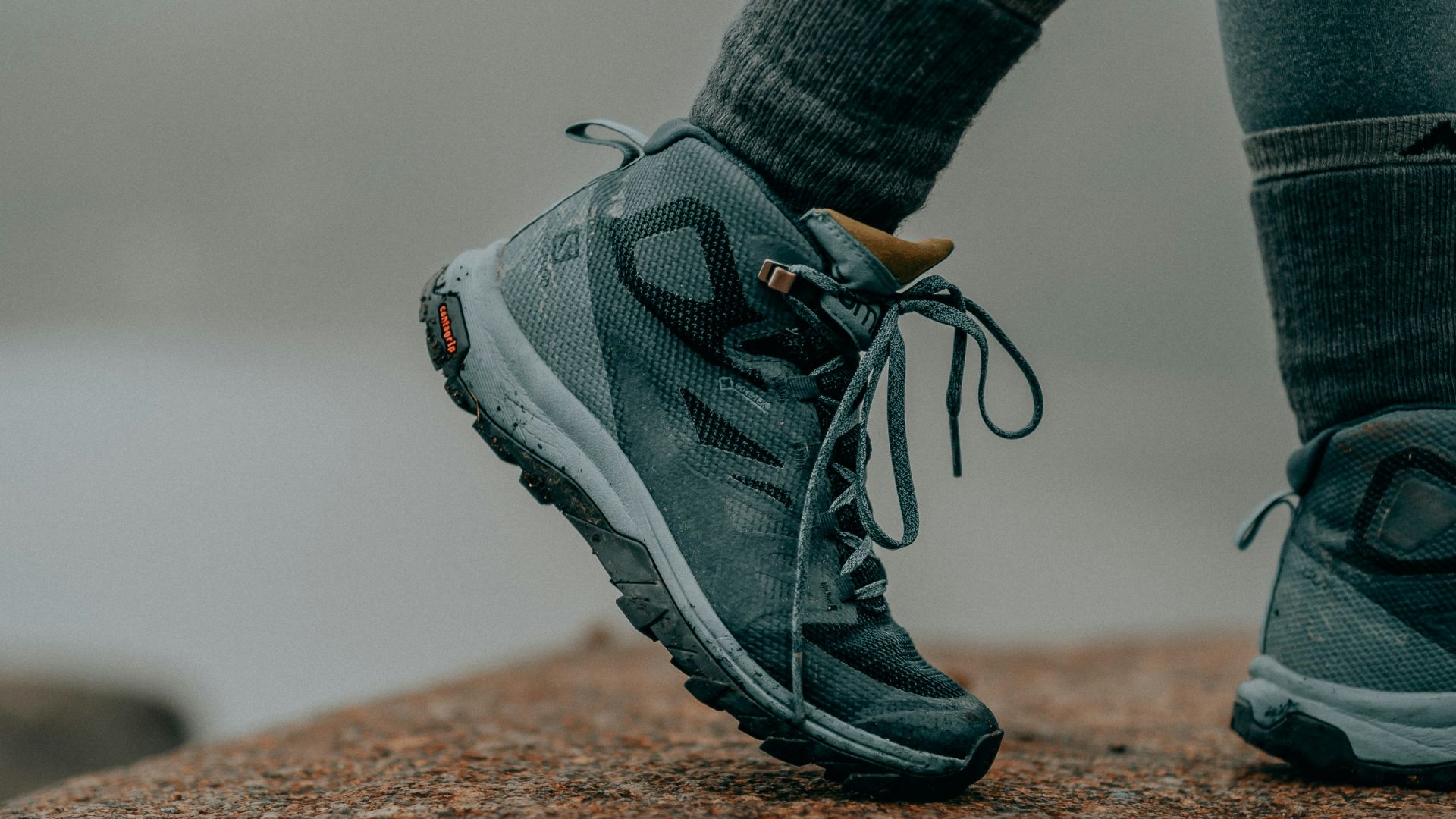 person in gray nike running shoes