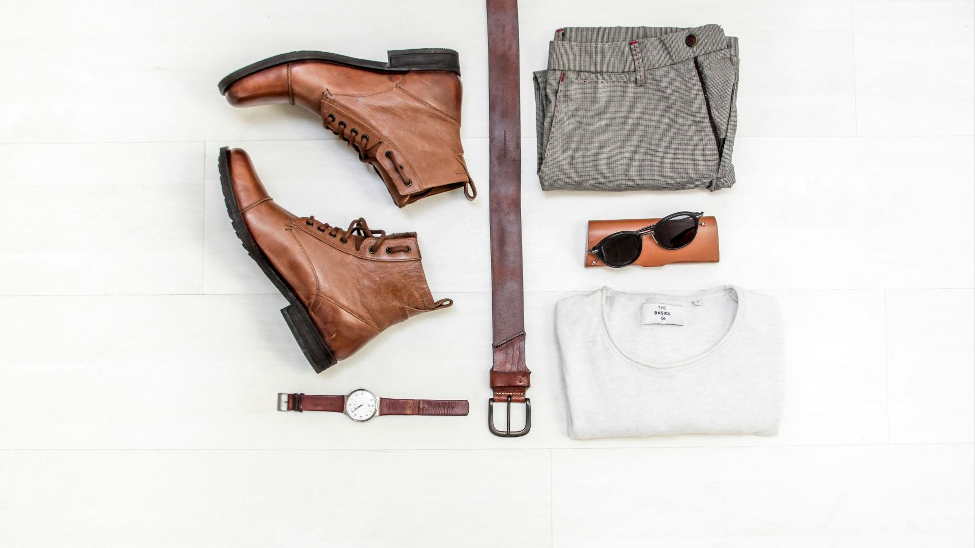 pair of brown leather boots beside bet