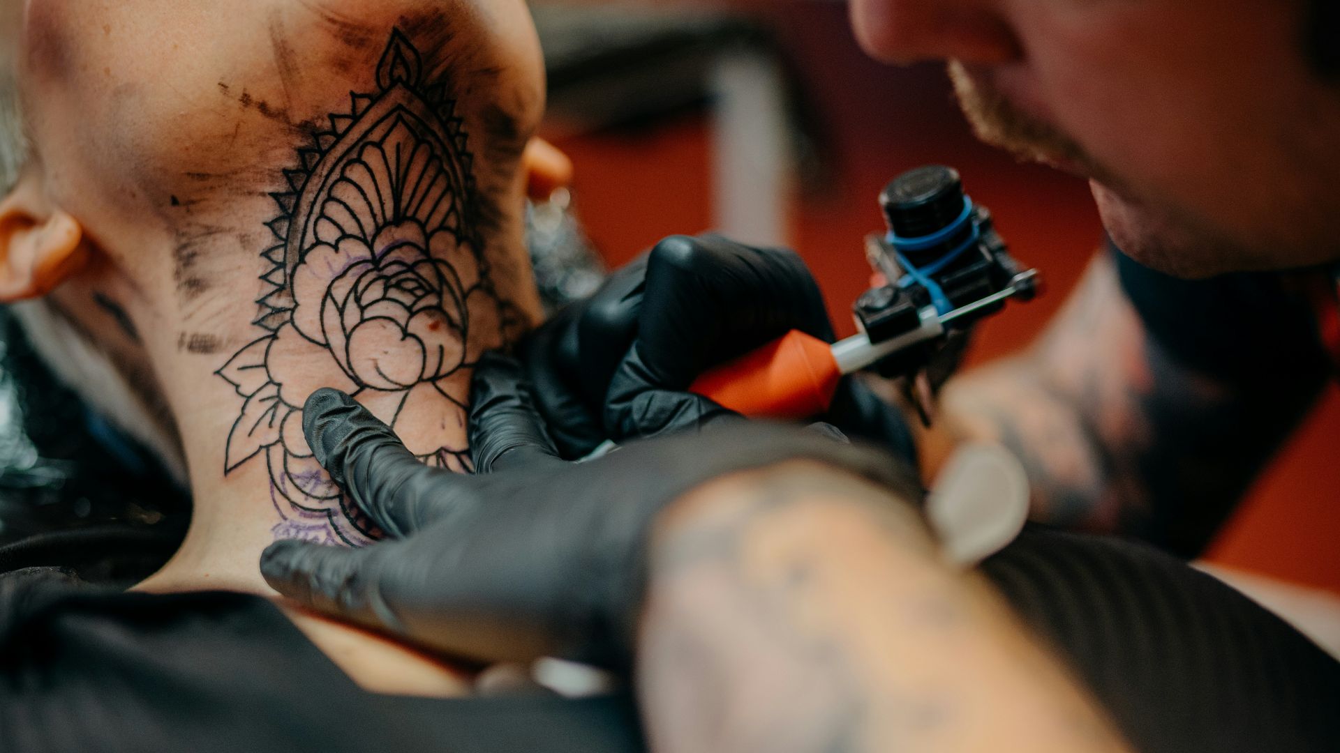 man in black shirt lying on black textile