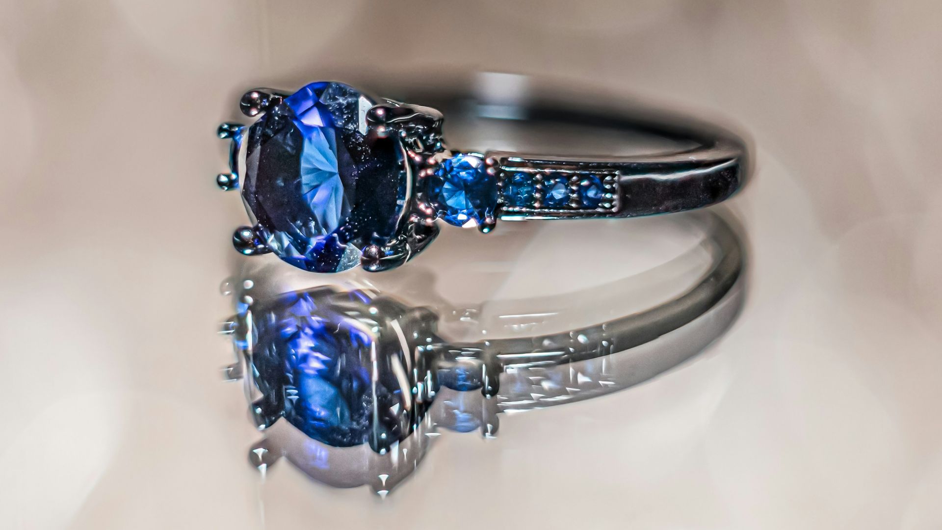 A close up of a ring with a blue stone