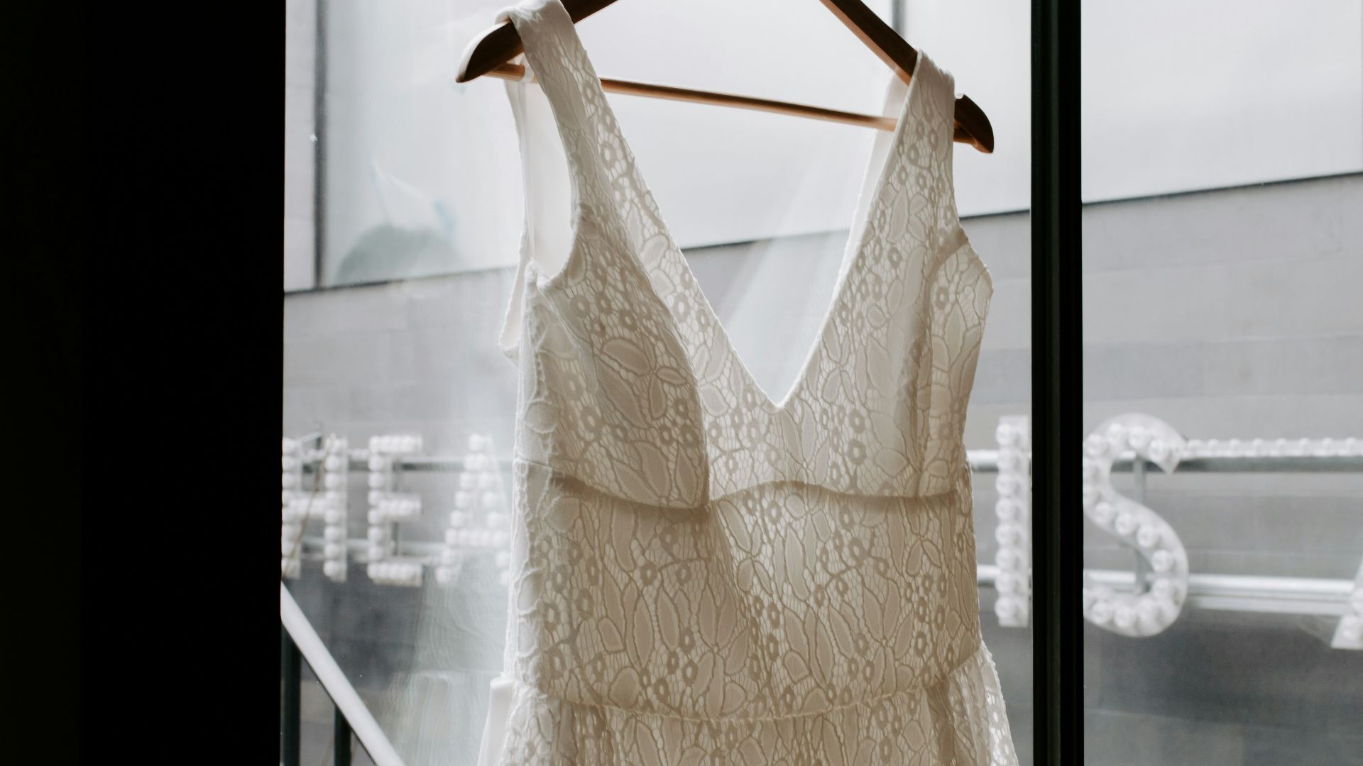 white sleeveless dress on clothes hanger