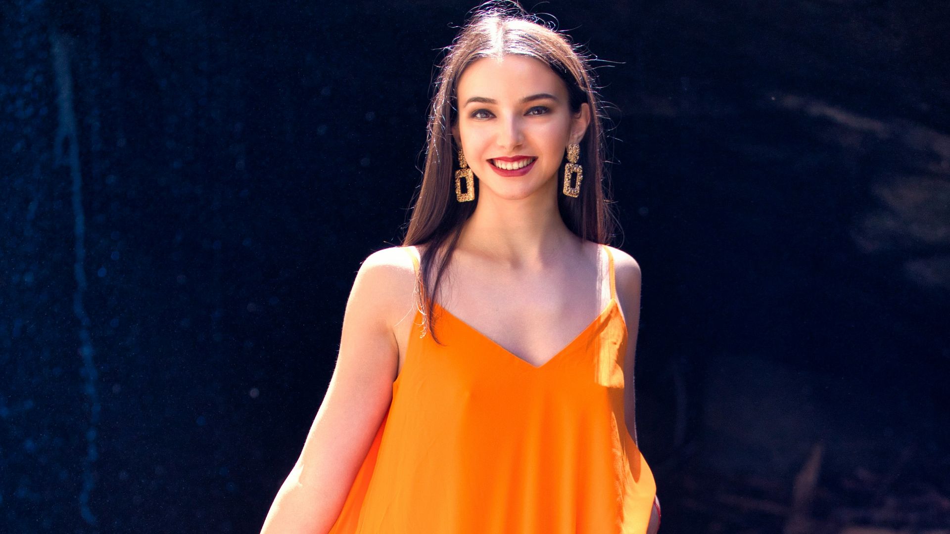 smiling woman wearing yellow dress