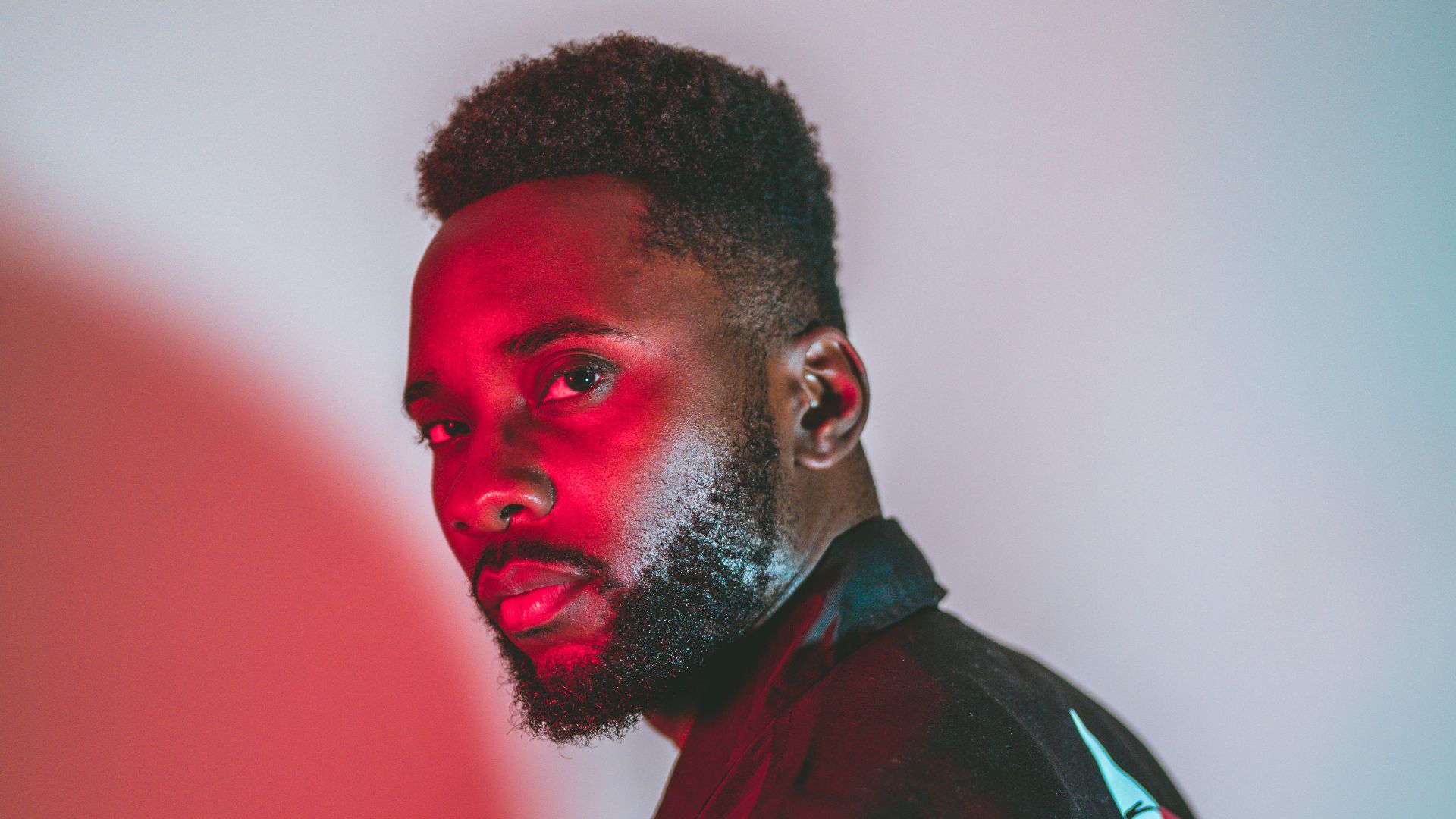 man in black and red jacket