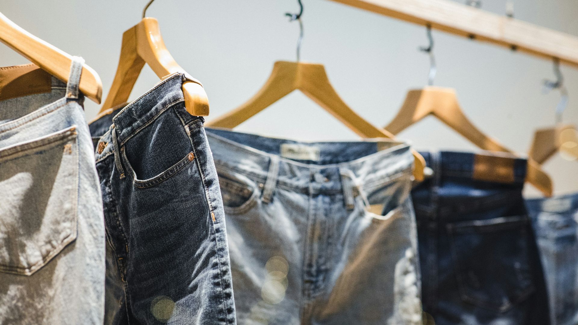 selective focus photography of hanged denim jeans