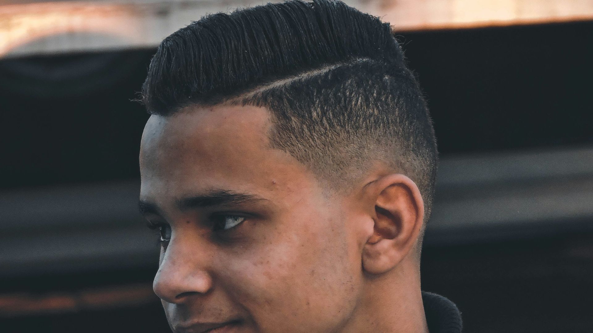 man in black turtleneck shirt and gray denim jacket