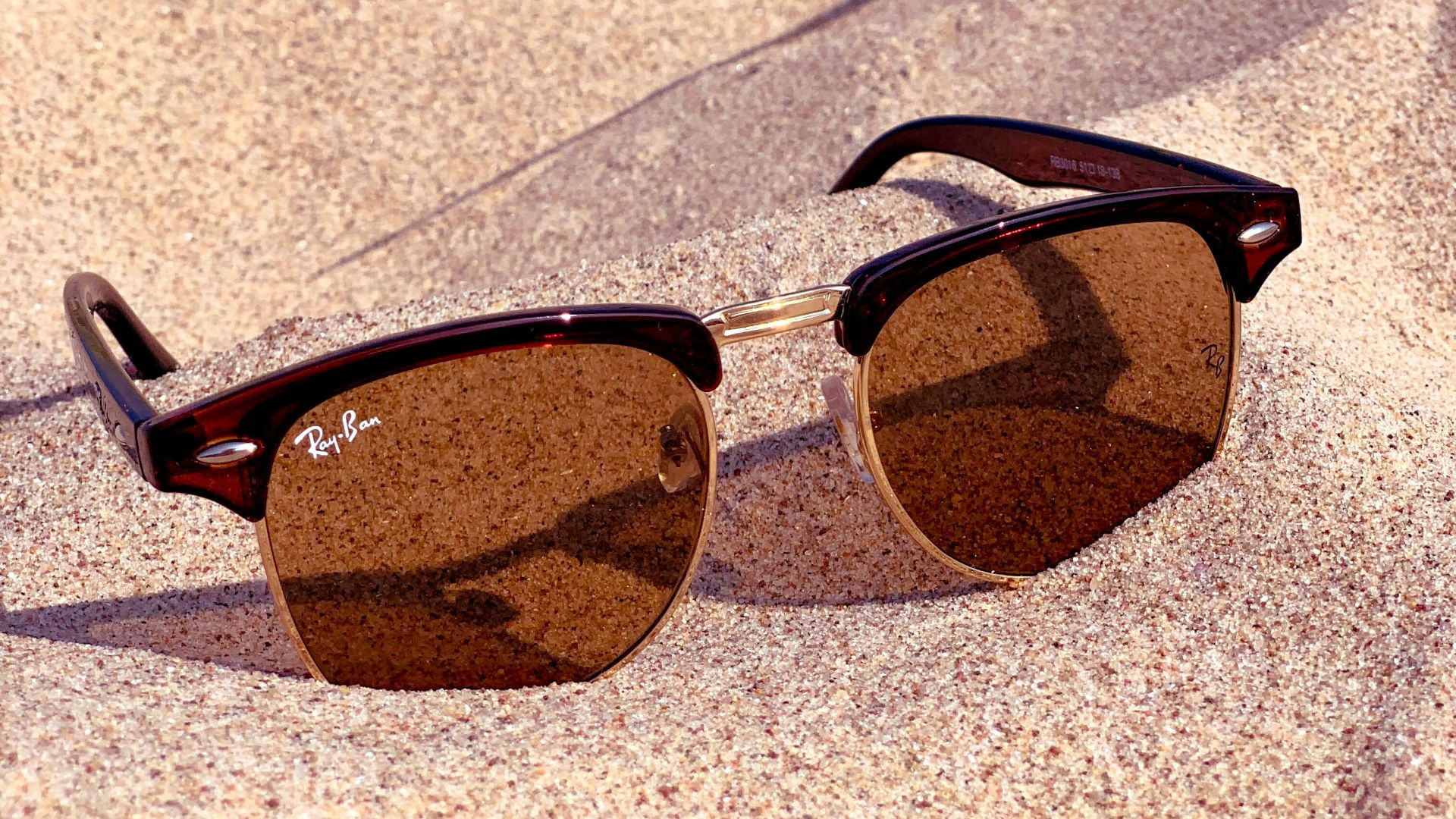 black framed brown lens sunglasses