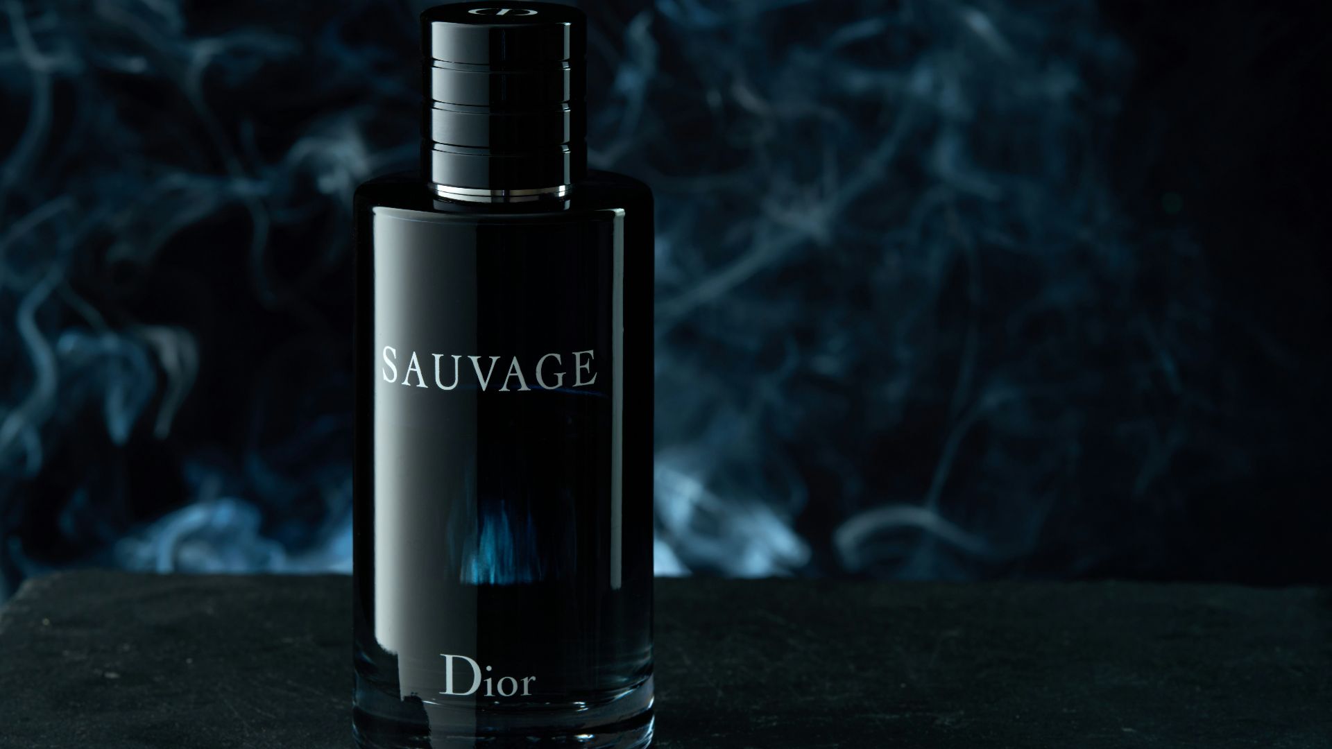 a bottle of perfume sitting on top of a table