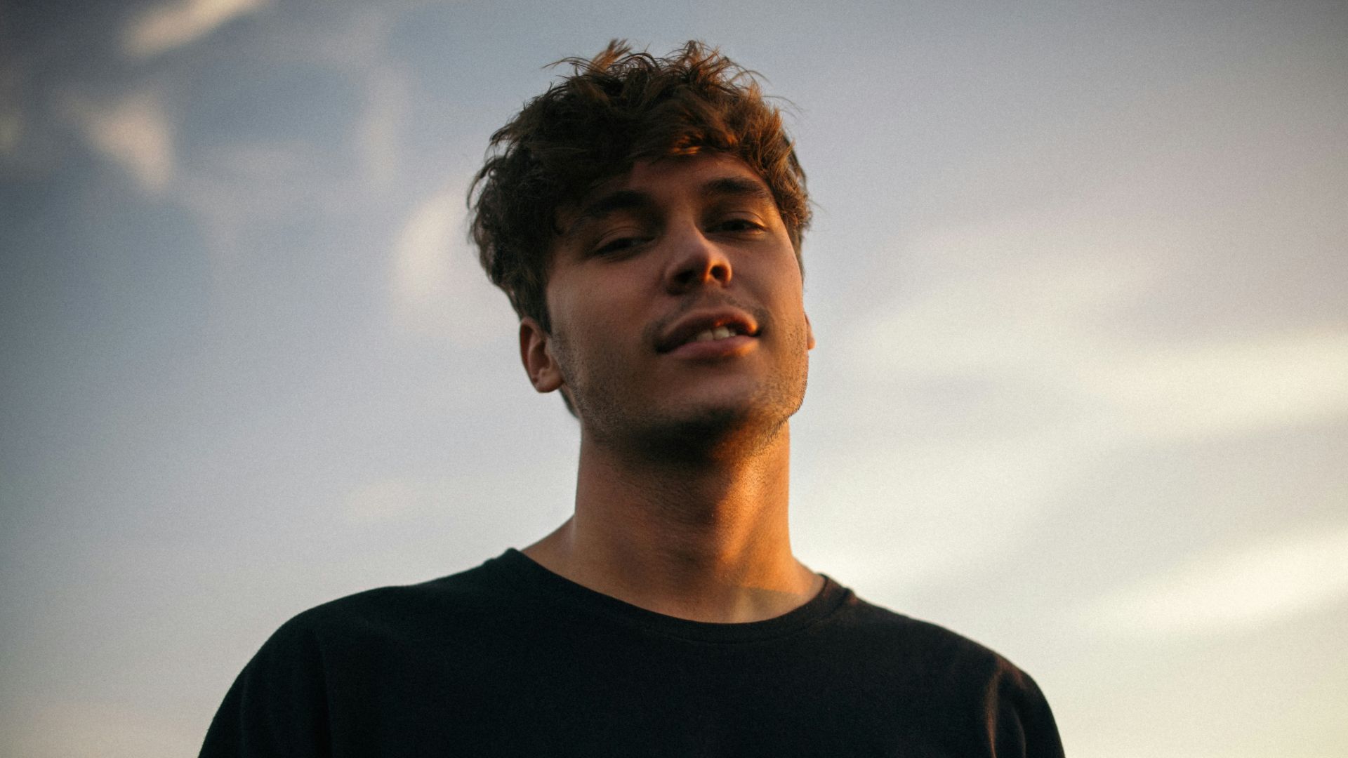 man smiling while taking photo