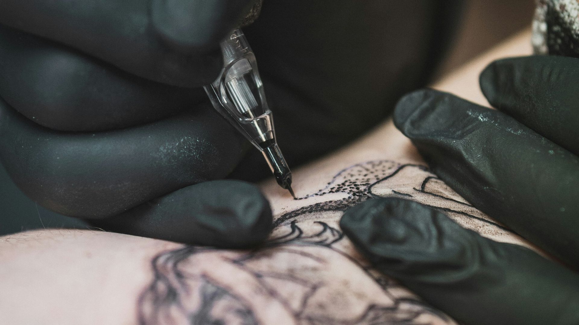 person doing tattoo