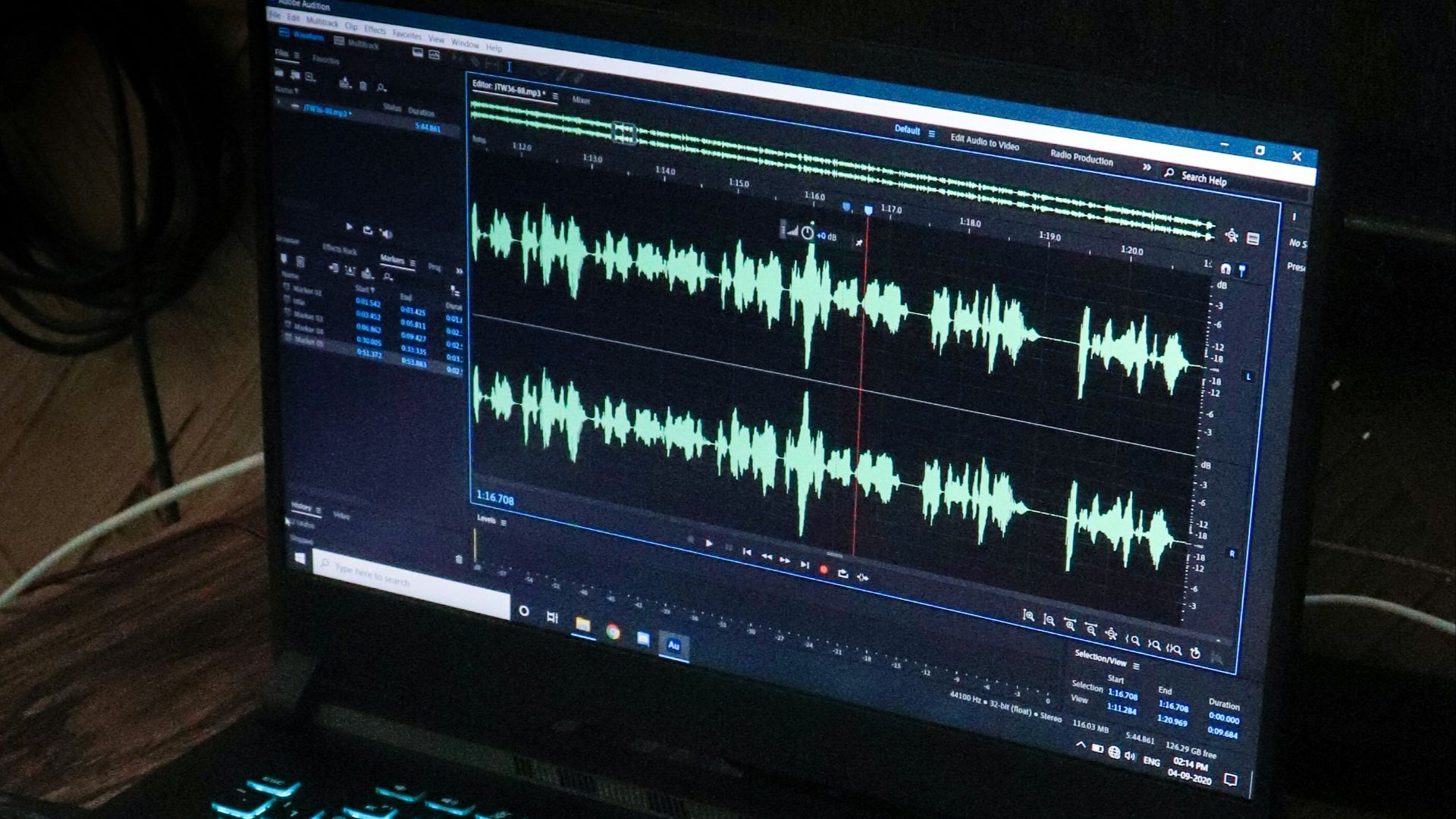 black laptop computer on brown wooden table