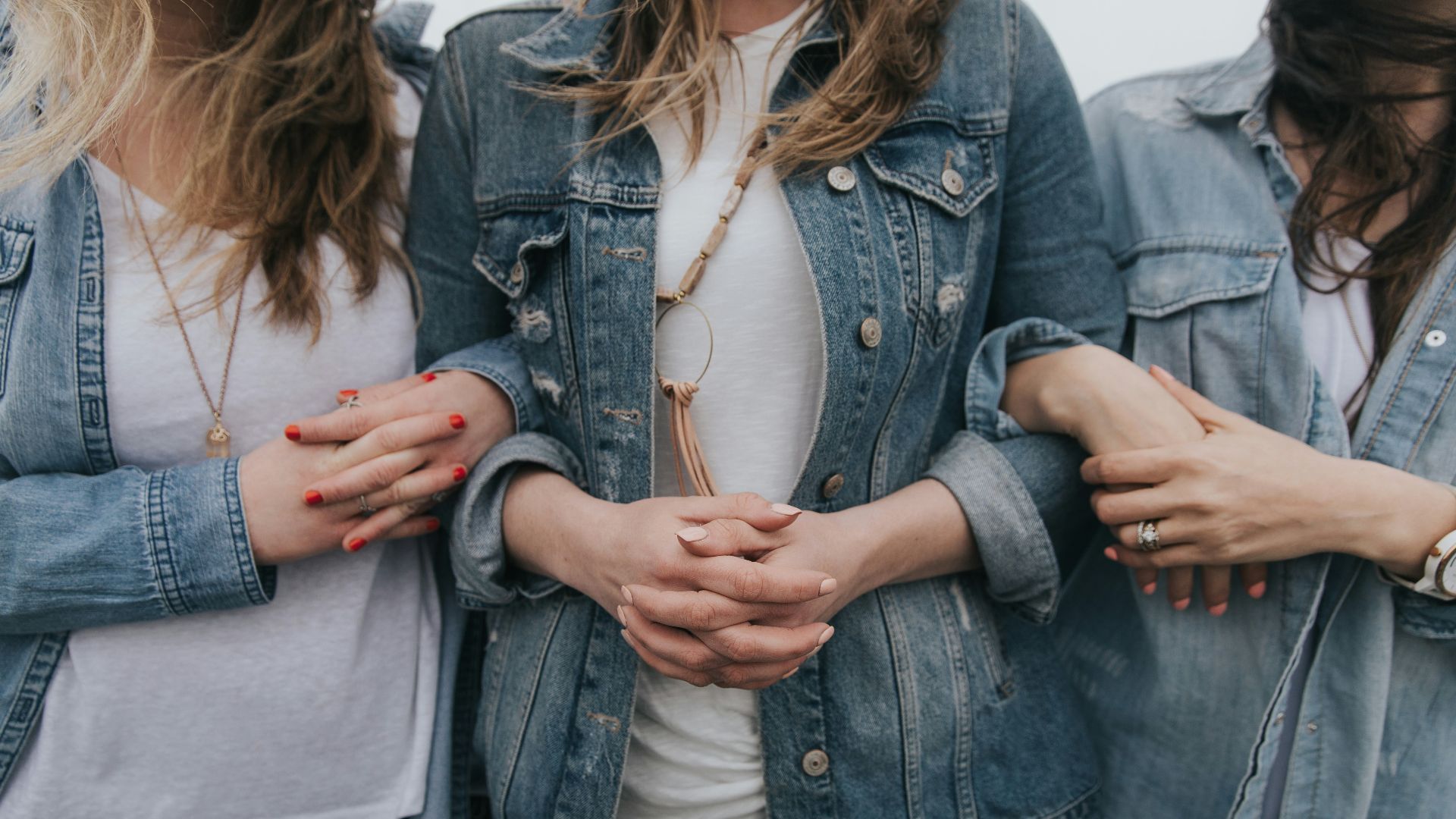woman in blue denim jacket and white shirt