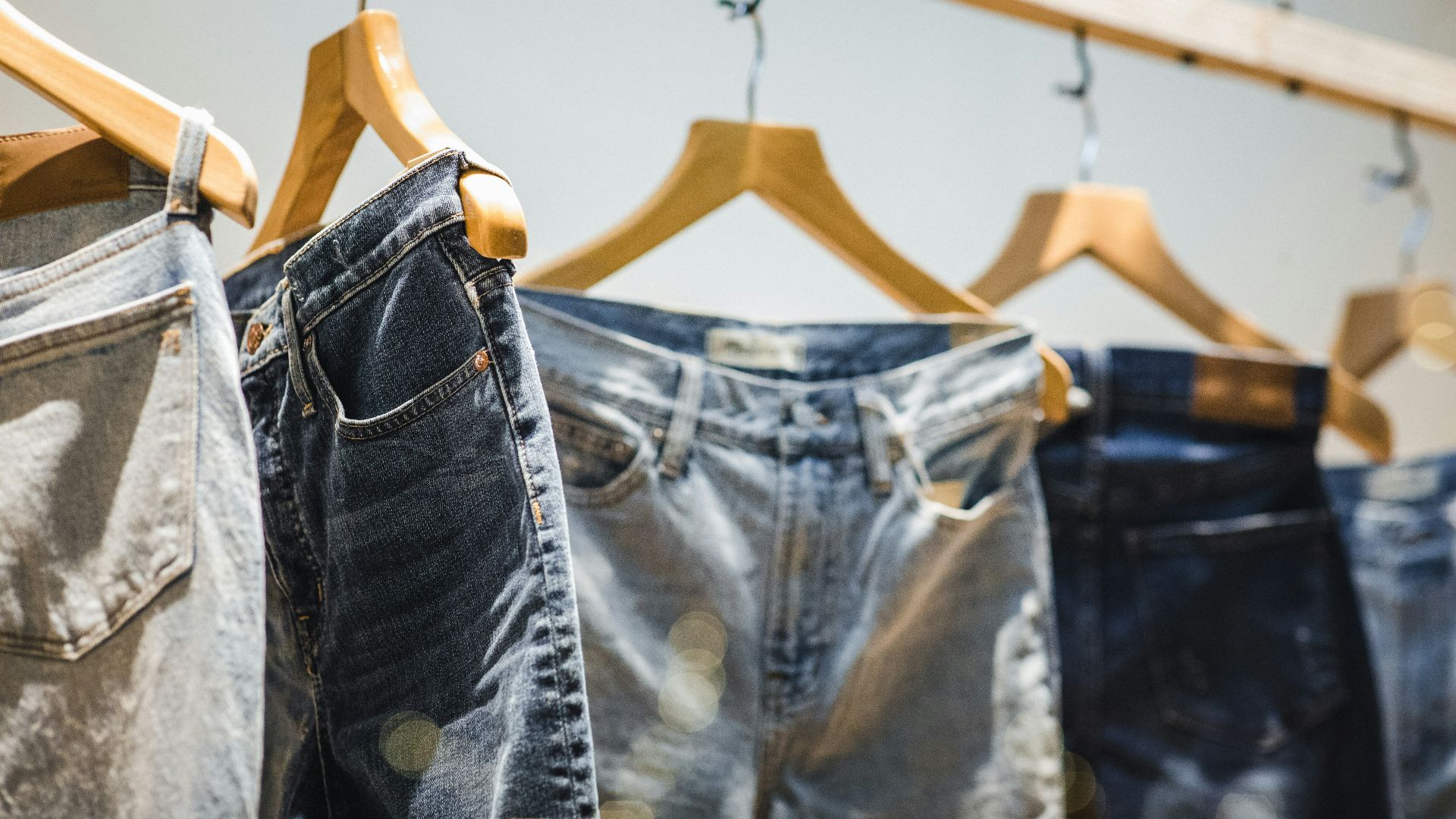 selective focus photography of hanged denim jeans