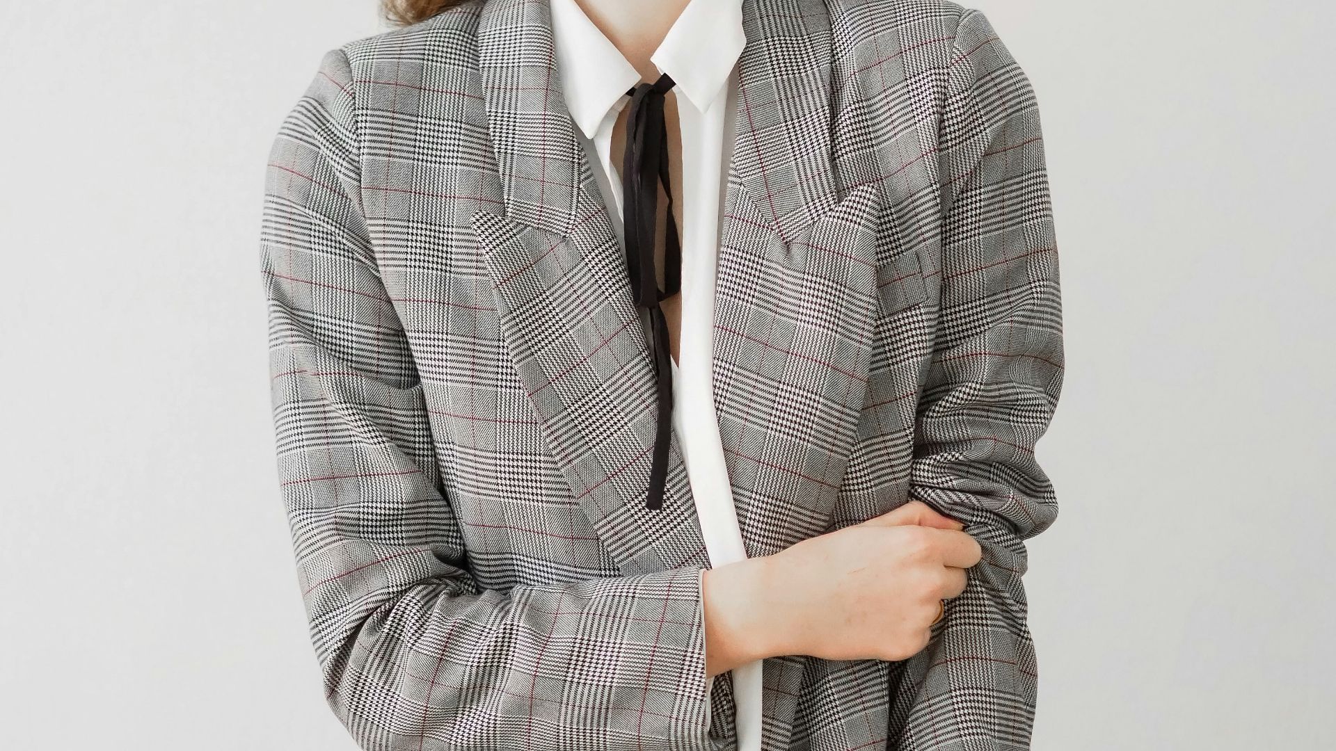 woman in gray blazer and black pants
