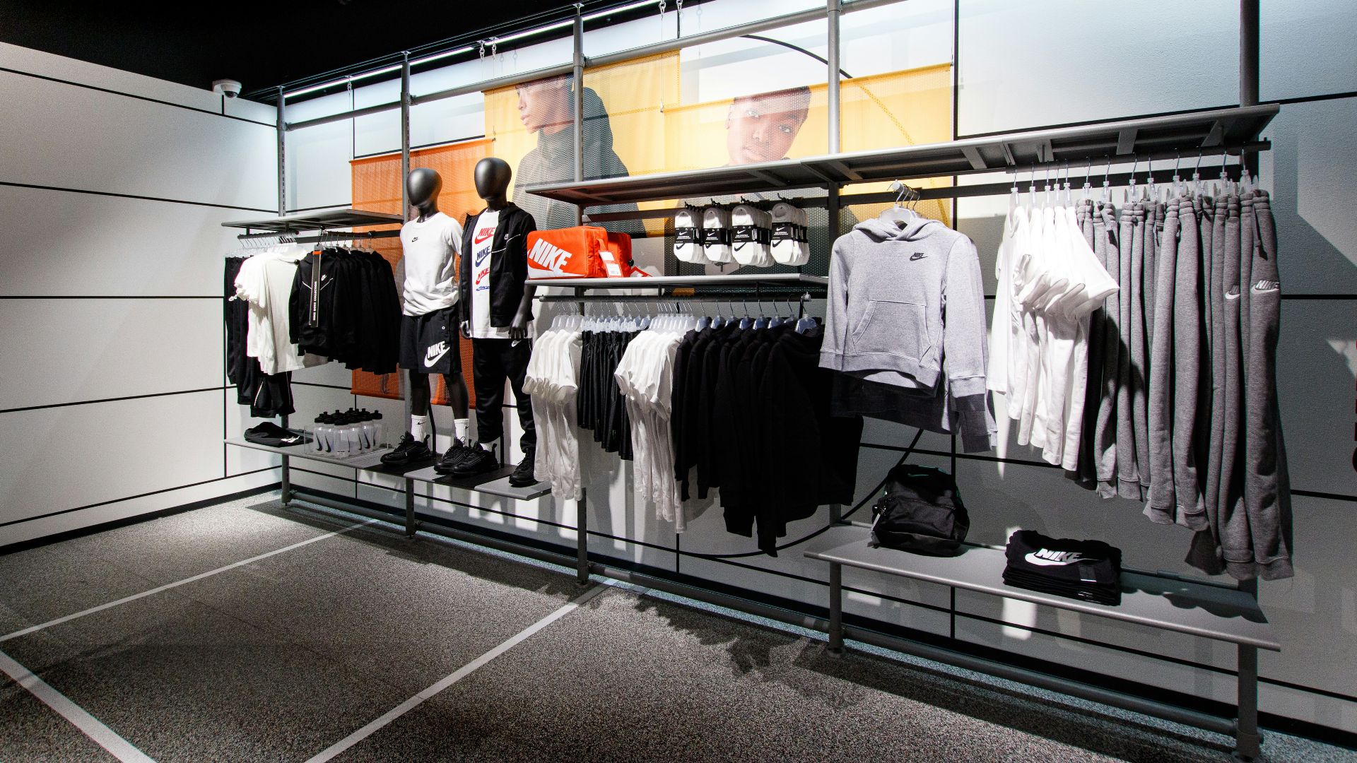 a display case with a variety of clothing on display