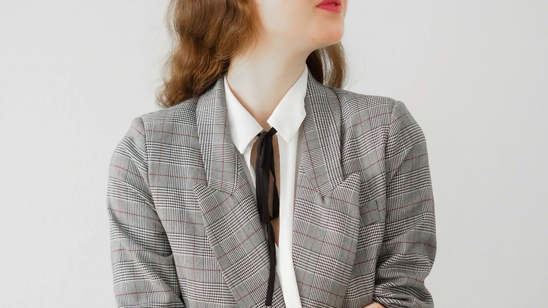 woman in gray blazer and black pants