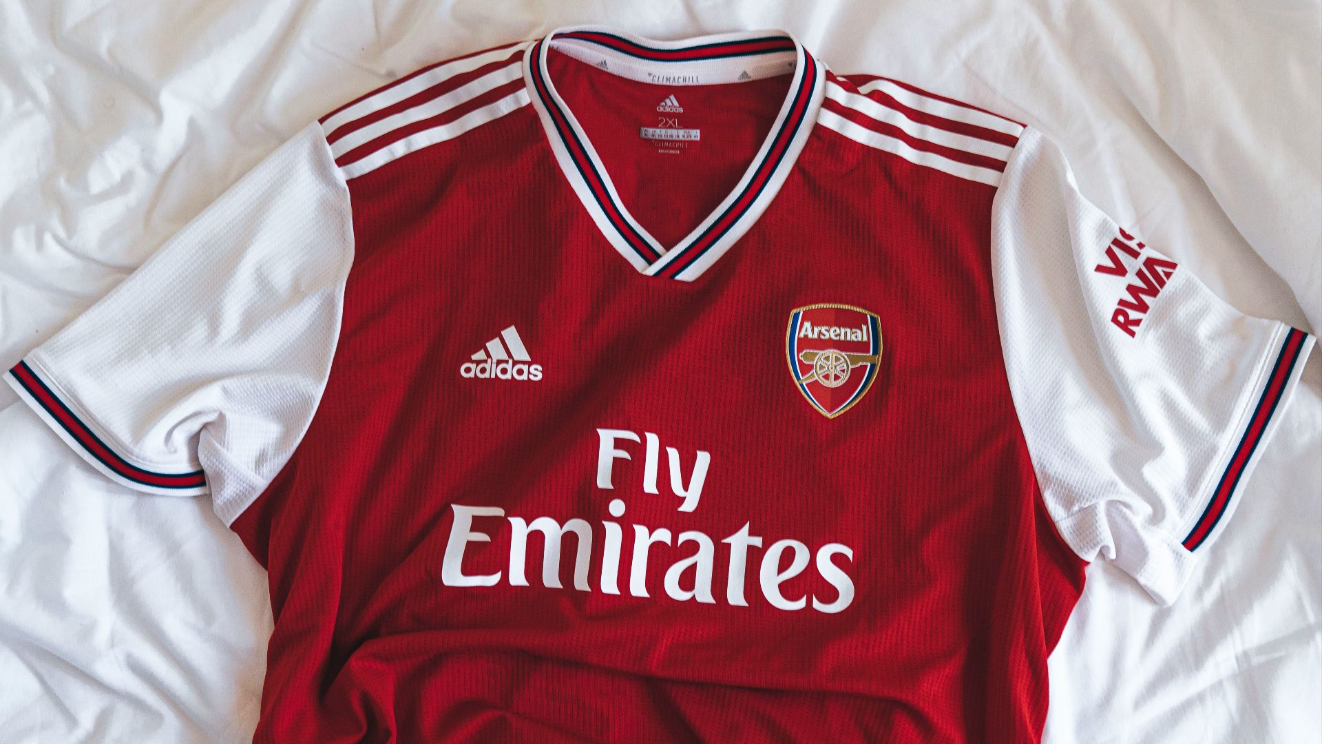 red and white Adidas Fly Emirates shirt